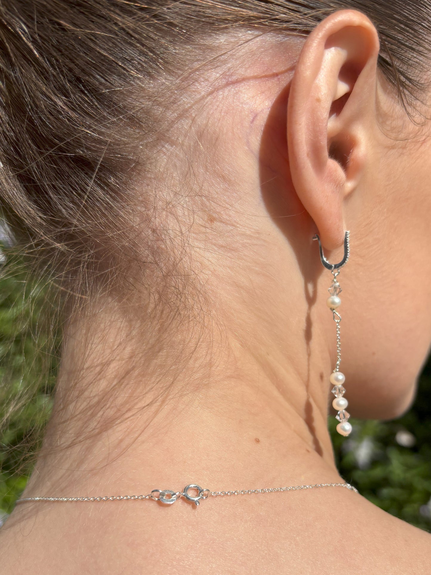 Pearl and crystal earrings using 4mm freshwater pearls and highest quality crystals (also 4mm). The earrings are suspended from sterling silver hoops studded with tiny crystals to reflect the light.