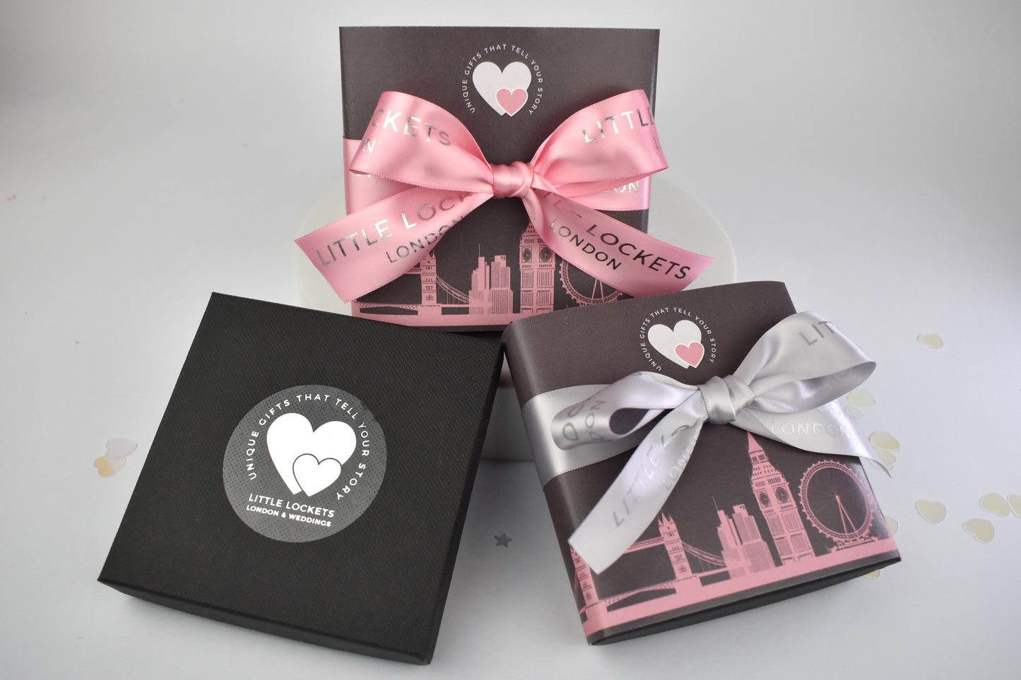 Little Lockets gift wrap options. In branded gift box, or with a London skyline wrap and hand tied pink or grey branded ribbon.