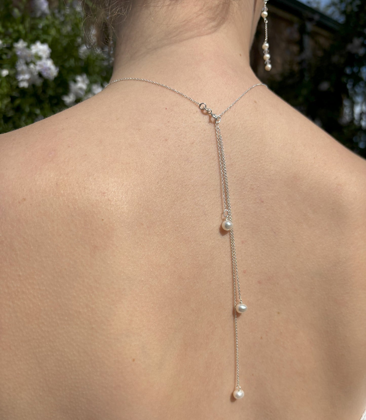 Three freshwater pearls suspended from sterling silver chain form the back of this elegant pearl drop necklace. The pearl drops are easily detached from the necklace allowing you to wear in the more traditional style.