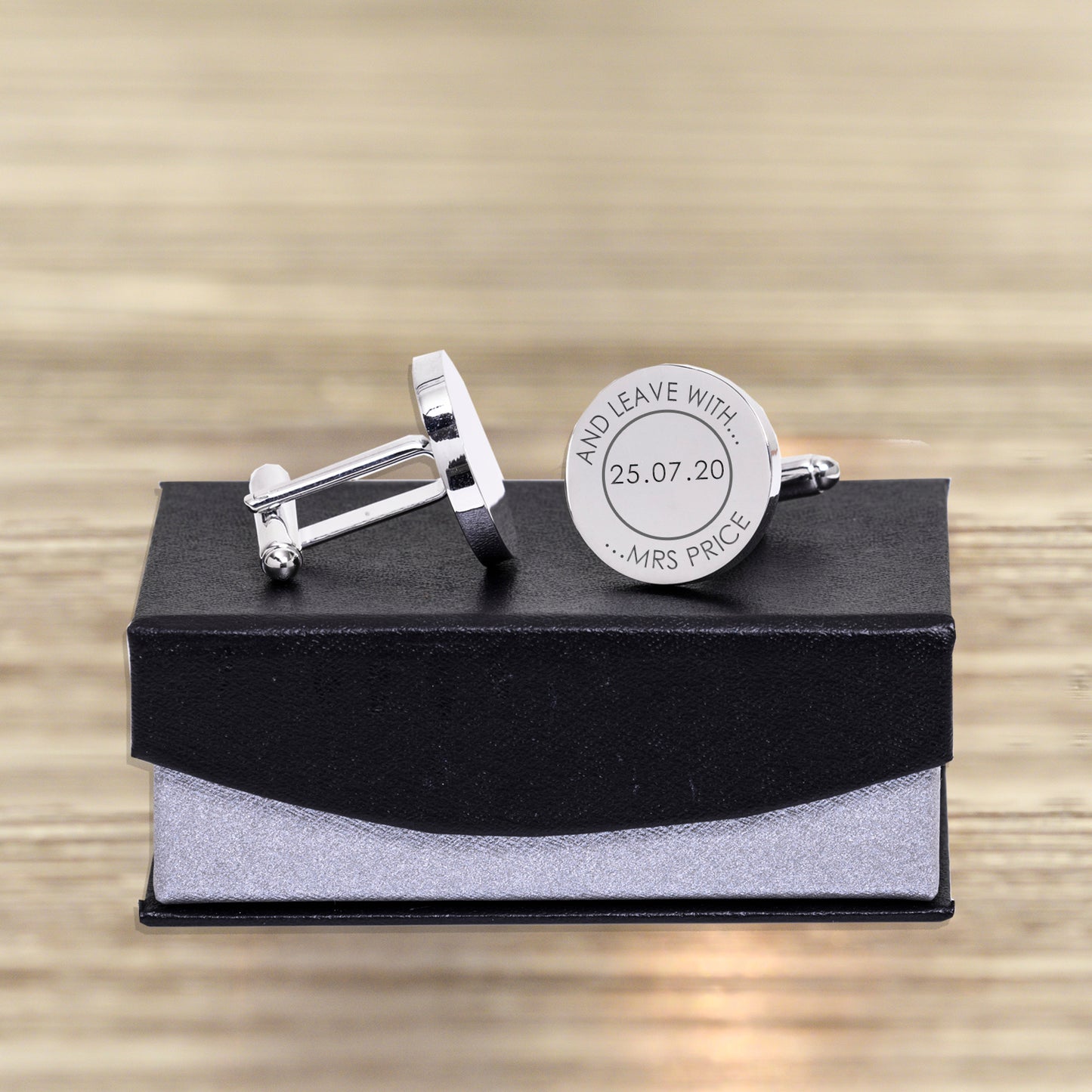 Fun cufflinks for the groom. Circular silver finish cufflinks which carry the date of your wedding and the time on a clock face. The message on the first cufflink reads "please meet Ms ..." and the second cufflink reads "and leave with Mrs..." Shown on gift box supplied with cufflinks.