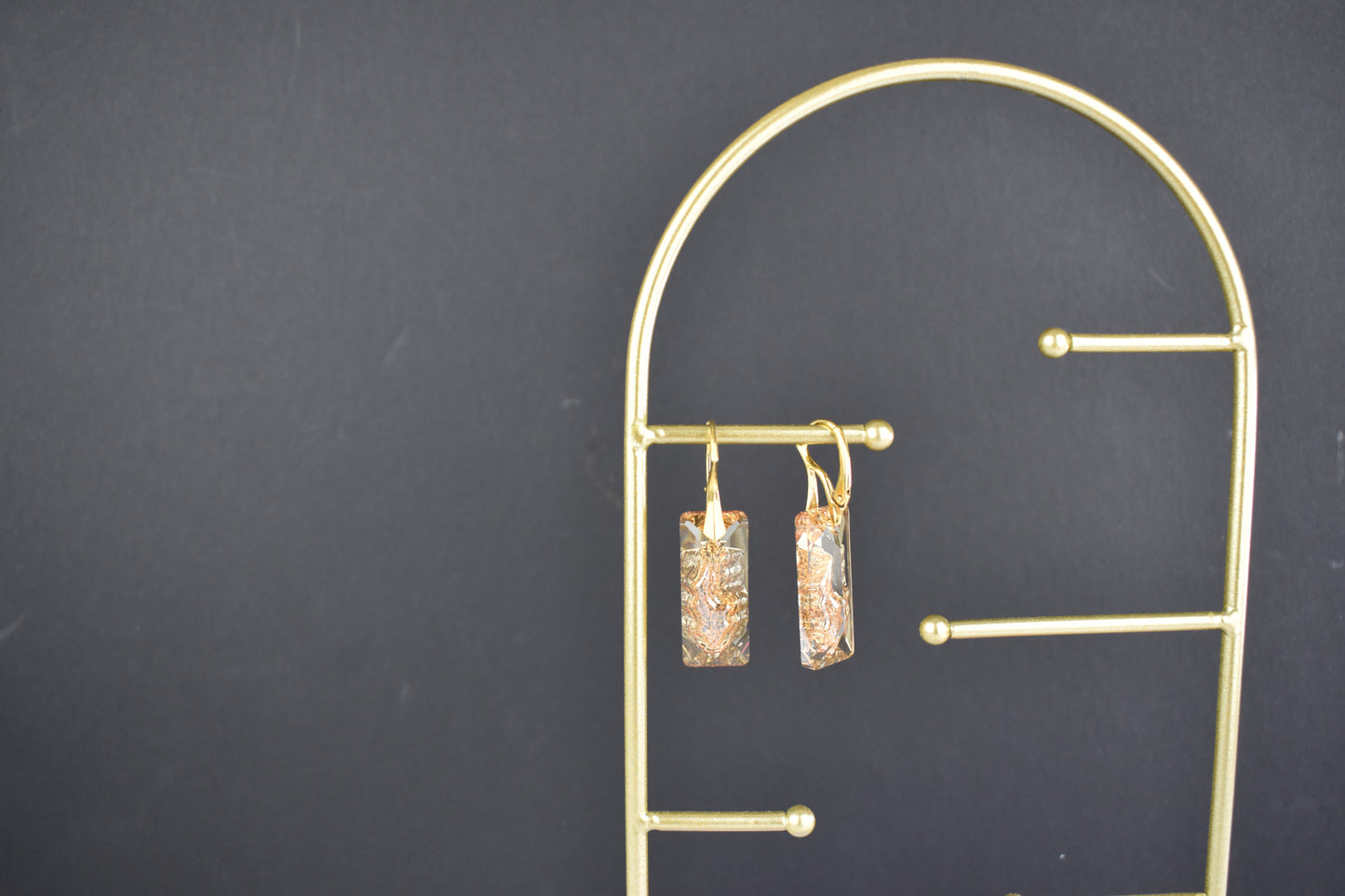 Highest quality Austrian crystal earrings shown in Golden Shadow,. The centre of the crystal is designed to look as if the crystal is still growing and catches the light beaufifully. Suspended from gold plated sterling silver lever back wires and gift boxed