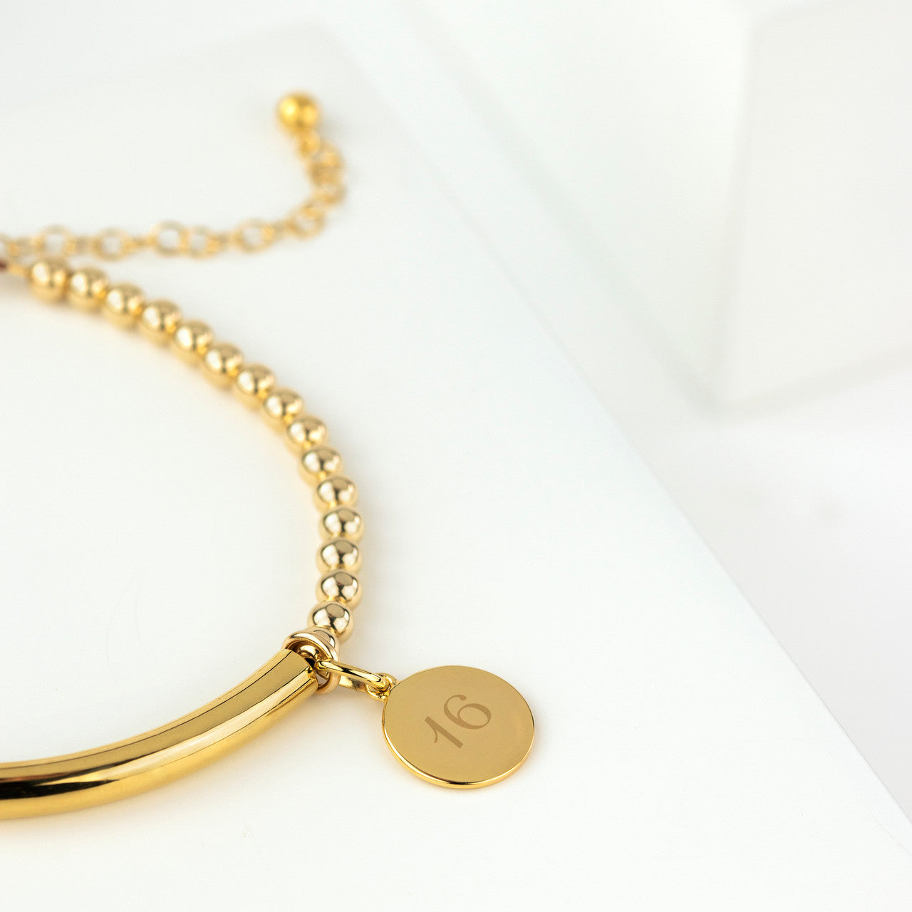 Gold filled bead and bracelet with 16 disc
