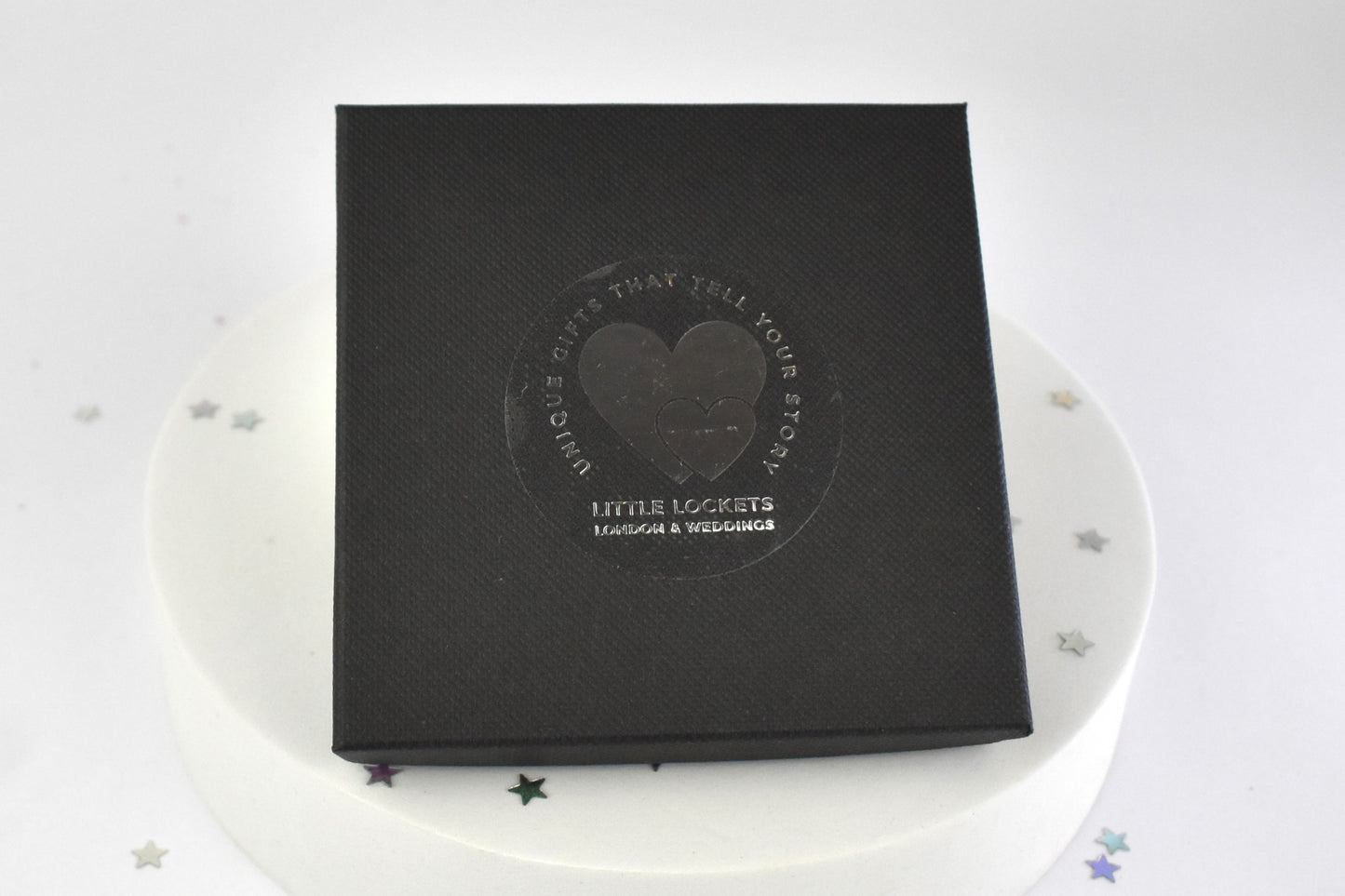Black box with 'Little Lockets' branding on a white background