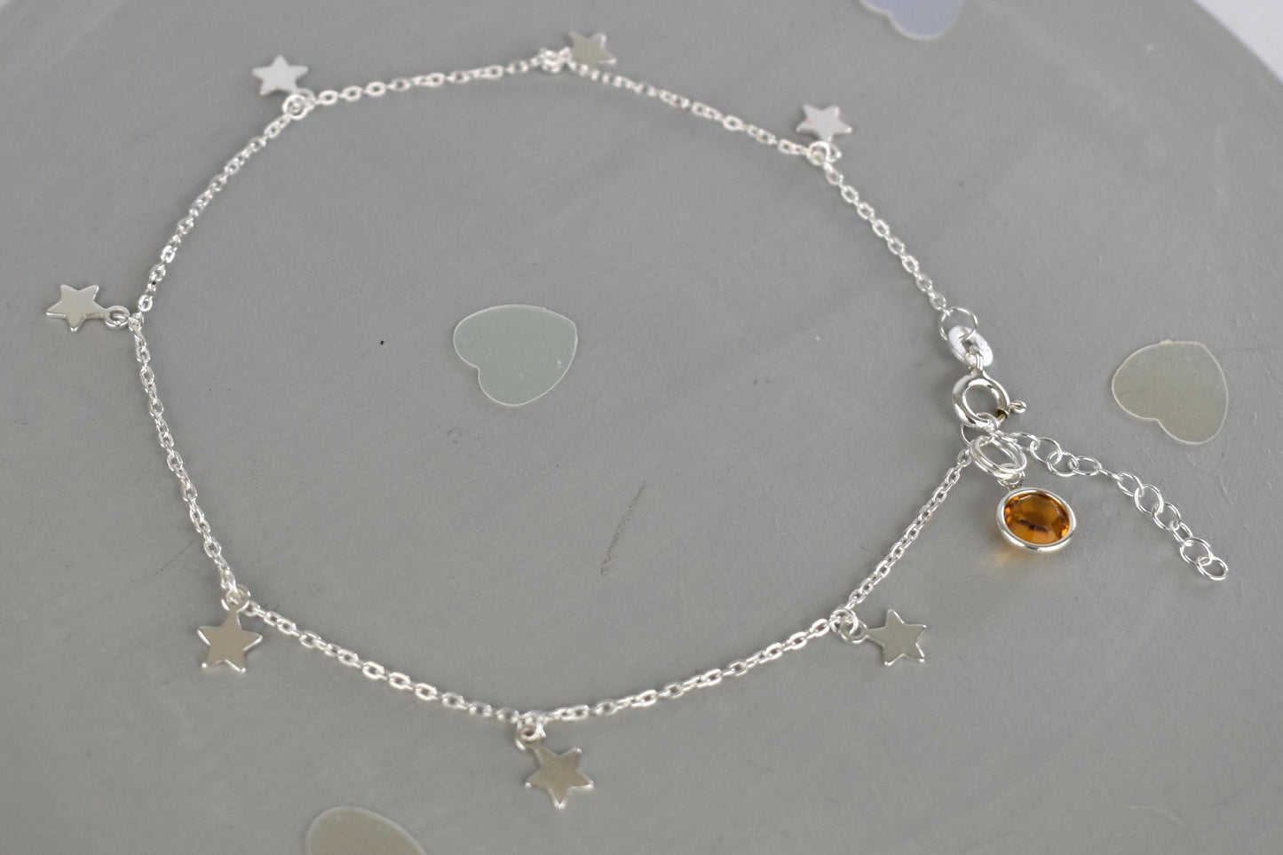 Boho Star Sterling Silver Anklet with Crystal Birthstone Charm. Crafted from sterling silver with flat cable chain links to sit comfortably. A secure fit, thanks to its 9 inch chain and a 1 inch extender.