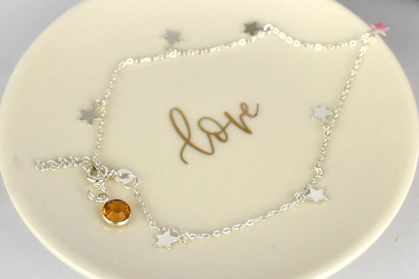 Boho Star Sterling Silver Anklet with Crystal Birthstone Charm. Crafted from sterling silver with flat cable chain links to sit comfortably. A secure fit, thanks to its 9 inch chain and a 1 inch extender.
