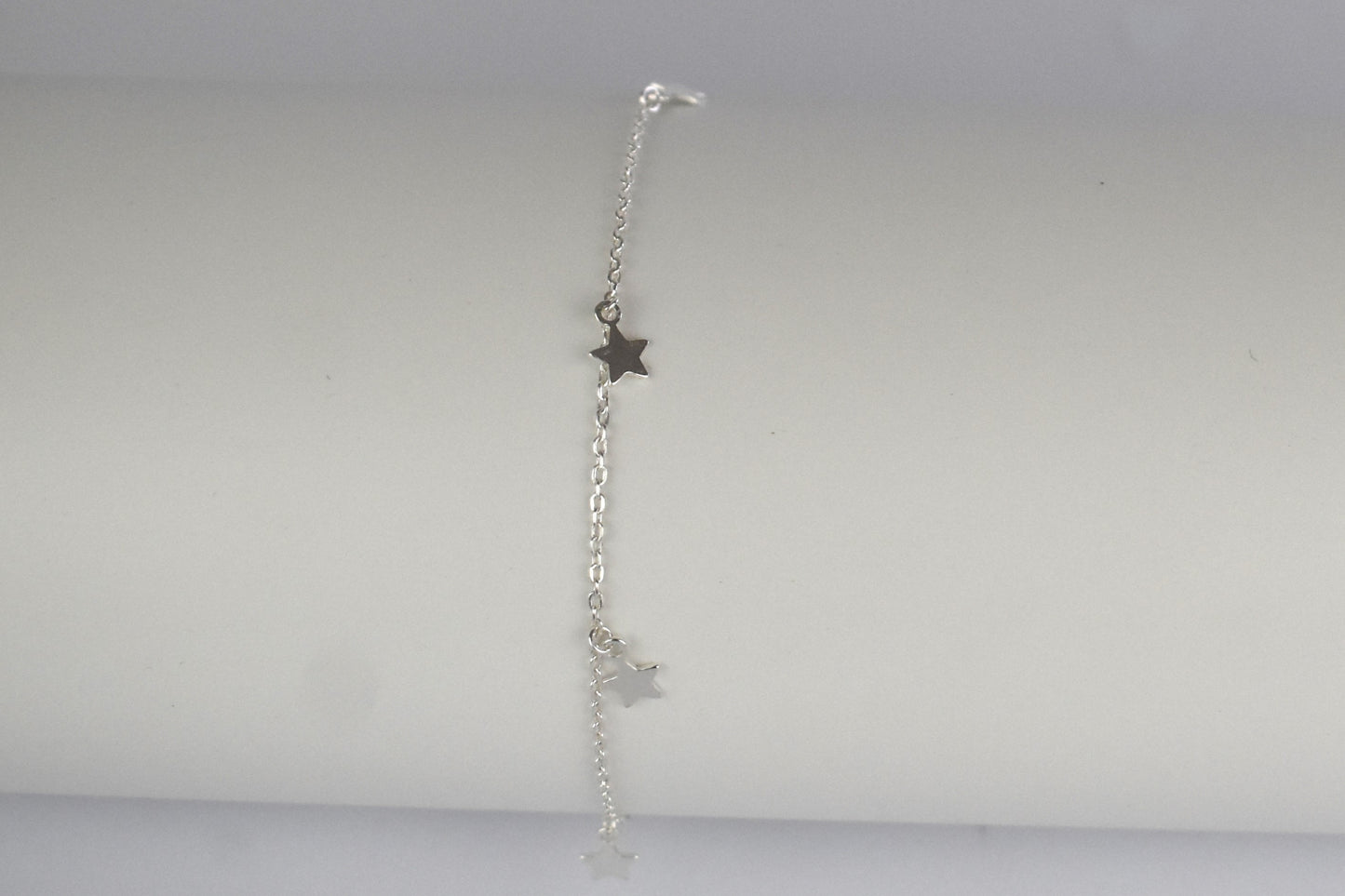 Boho Star Sterling Silver Anklet with Crystal Birthstone Charm. Crafted from sterling silver with flat cable chain links to sit comfortably. A secure fit, thanks to its 9 inch chain and a 1 inch extender.