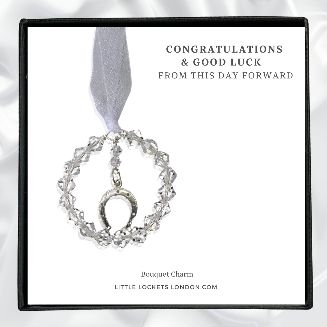 Sterling silver horseshoe charm surrounded by a circle fo high quality Austrian crystals. Gift boxed with the word Congratualations and Good Luck, from this day forward. Or choose your own words.