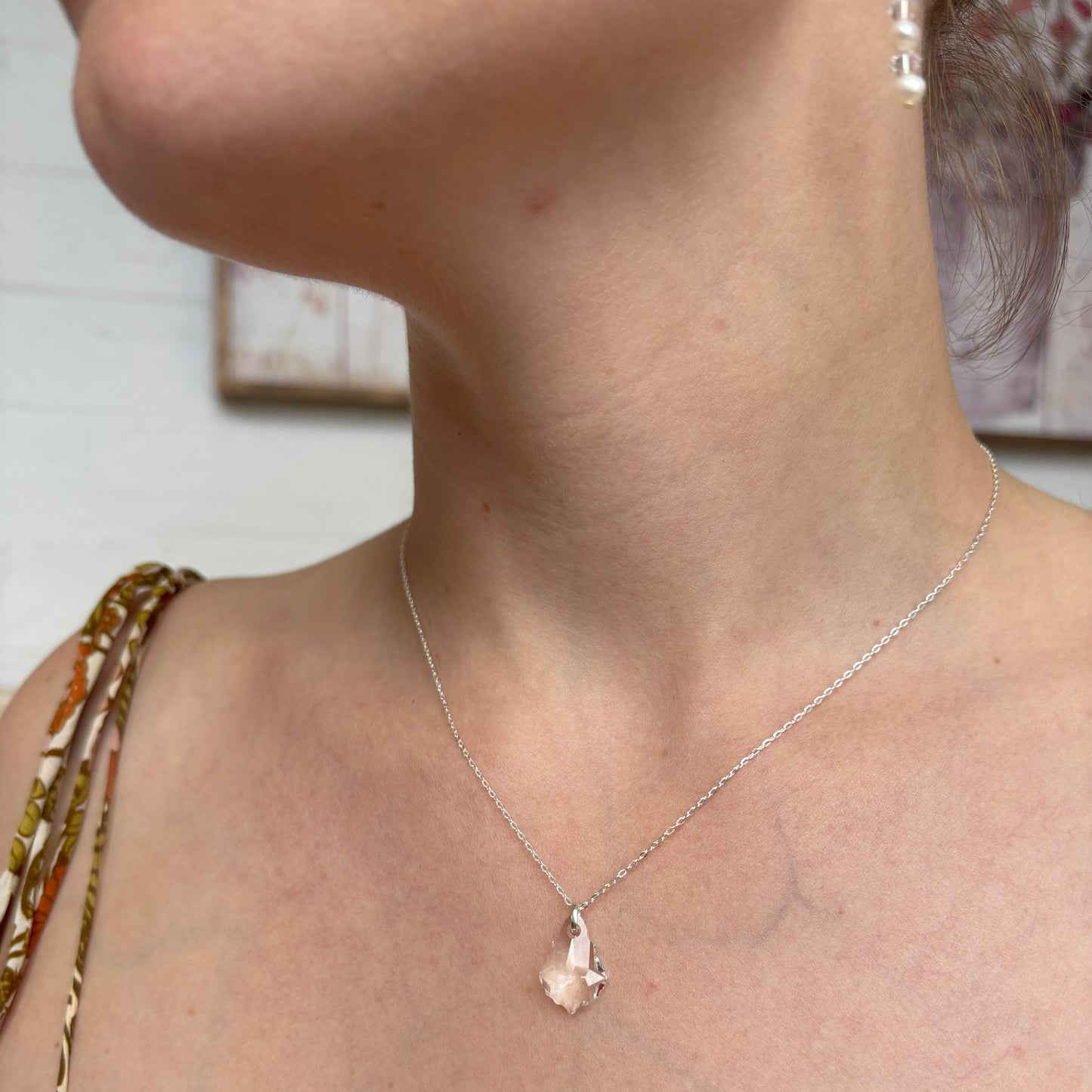 Our simple Baroque pendant features the highest quality crystal drop suspended from a sterling silver adjustable chain. The back of the necklace features two further bqroque drops, making it the perfect back drop necklace for wedding or cocktail dresses