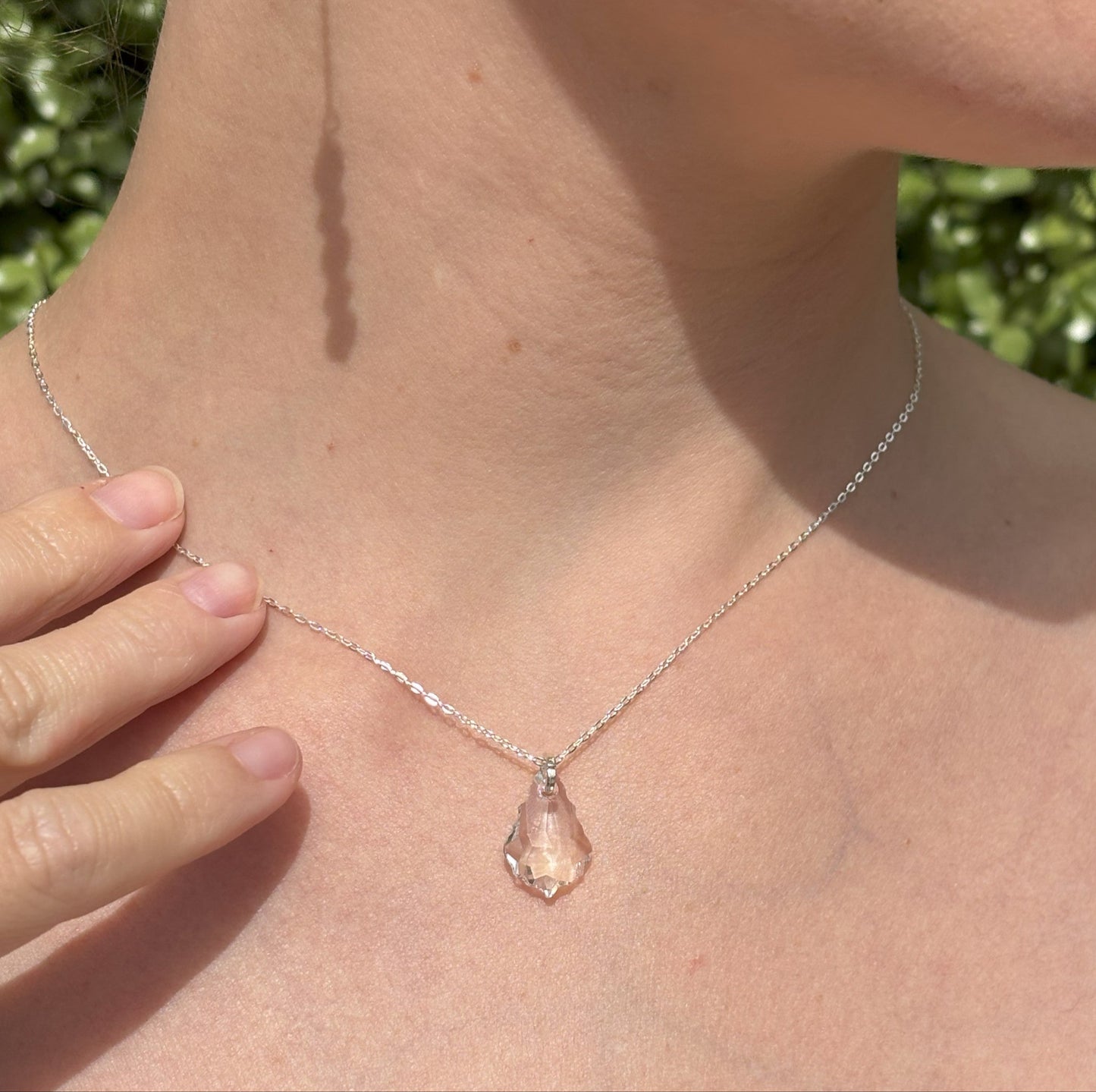 Our simple Baroque pendant features the highest quality crystal drop suspended from a sterling silver adjustable chain. The back of the necklace features two further bqroque drops, making it the perfect back drop necklace for wedding or cocktail dresses.
