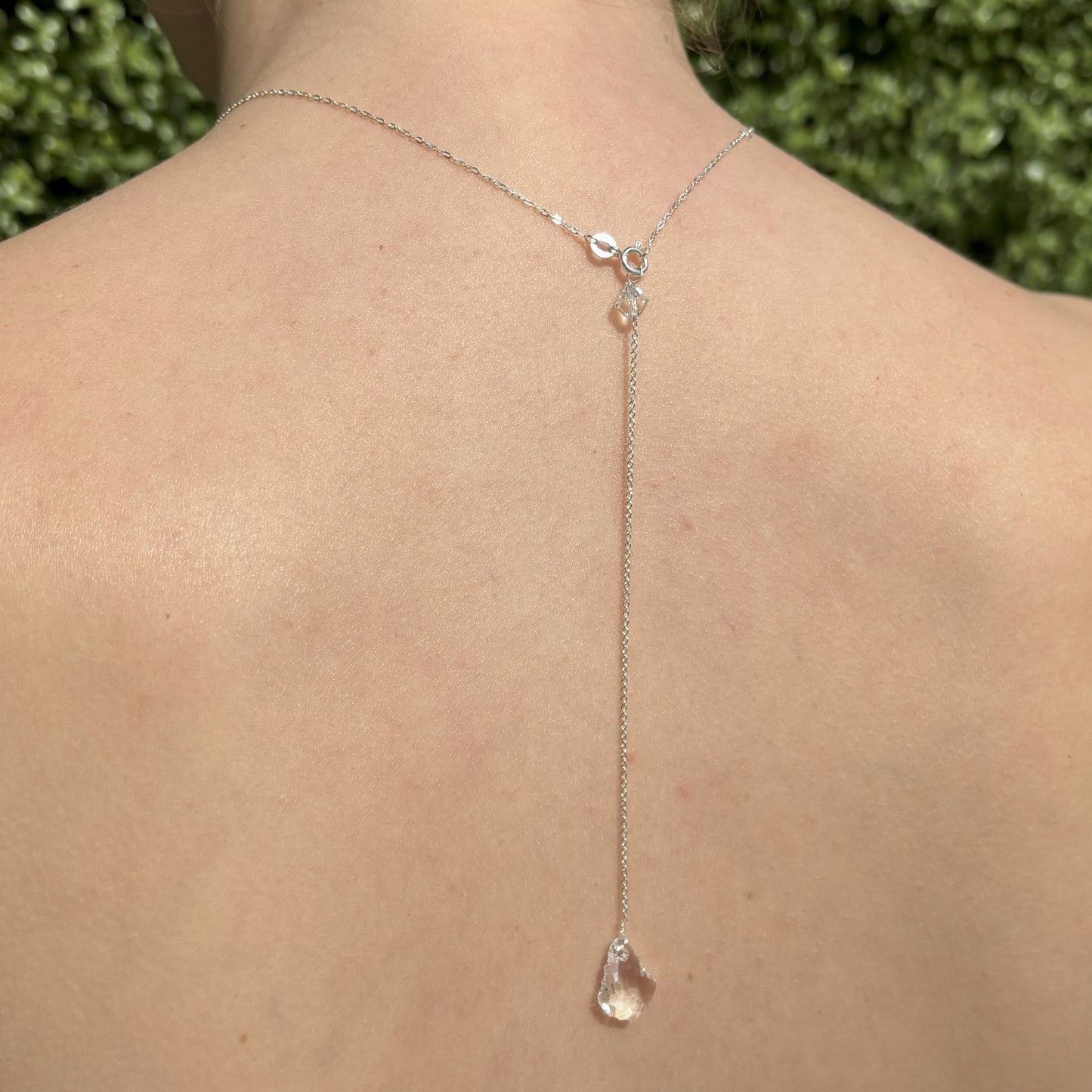 Our baroque back drop necklace features a single highest quality baroque crystal drop suspended from sterling silver chain on an adjustable sterling silver necklace. The back drop is easily removed so that the necklace can be worn in the traditional style.