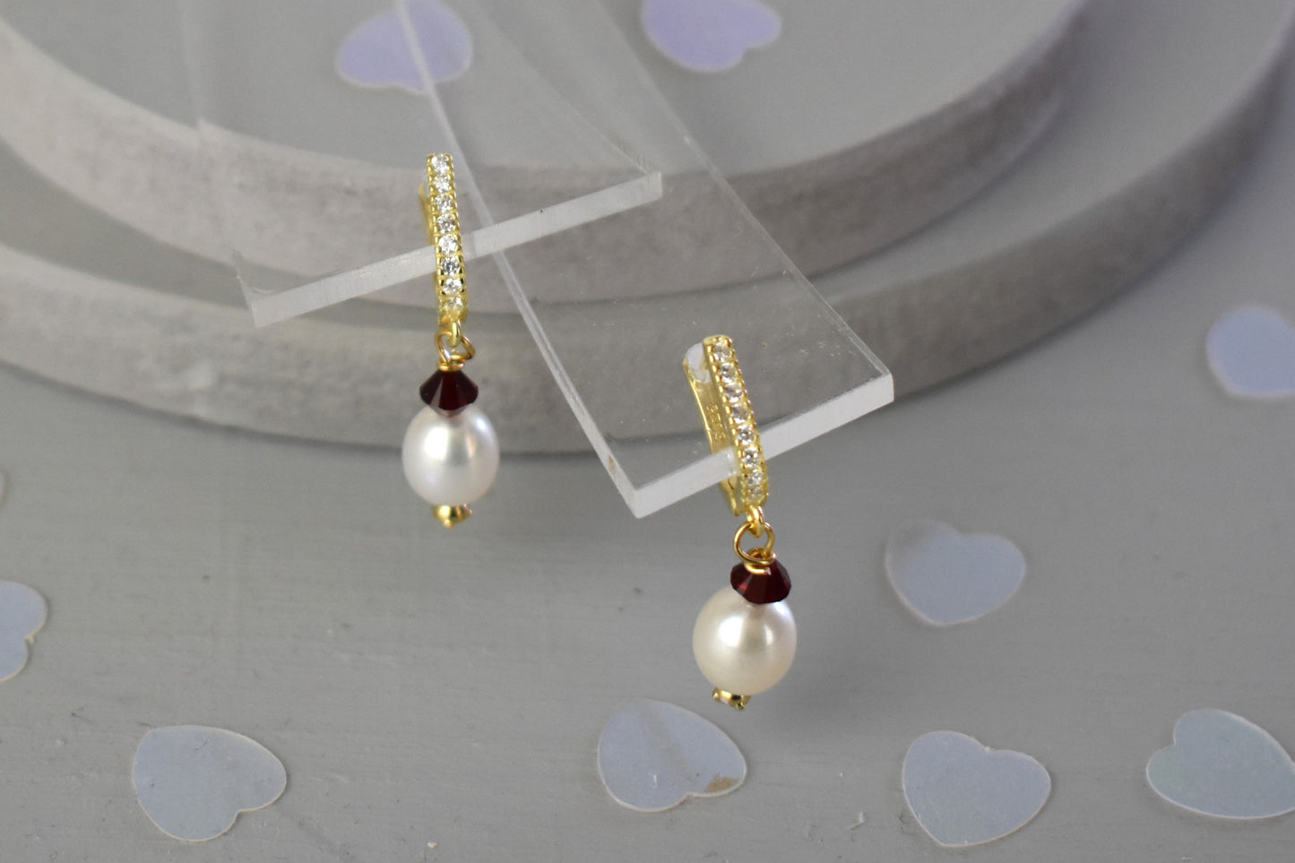 freshwater pearl earrings with Siam (ruby) Austrian crystals hung from your choice of sterling silver or gold plated ear wires trimmed with diamante