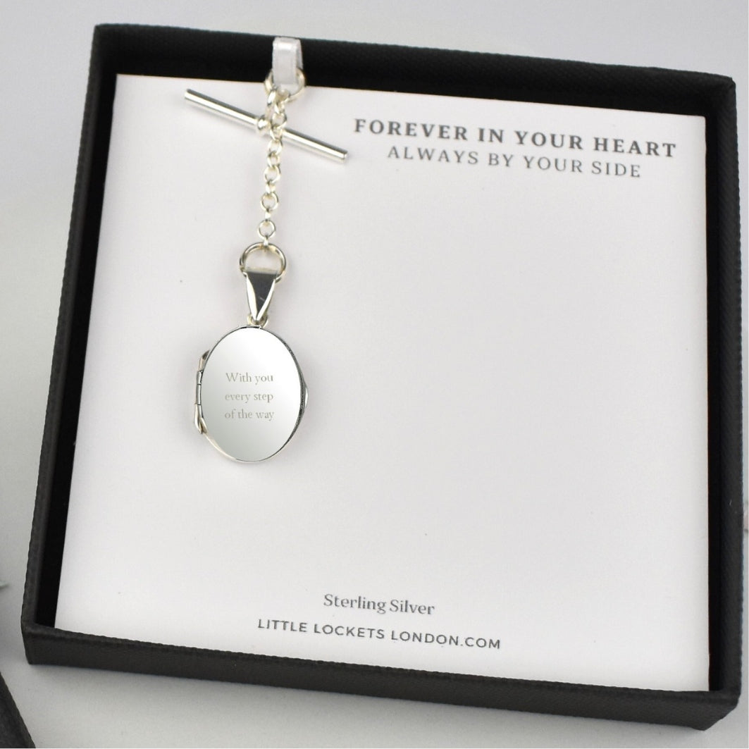Sterling Silver Mens Engraved Photo Memorial Locket. Sterling silver elegant locket features a polished finish and offers the choice of a T-bar or spring clasp fastening. On gift card in gift box.