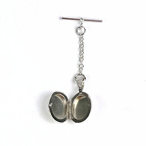 Opening locket can hold up to two photograhs. Template supplied