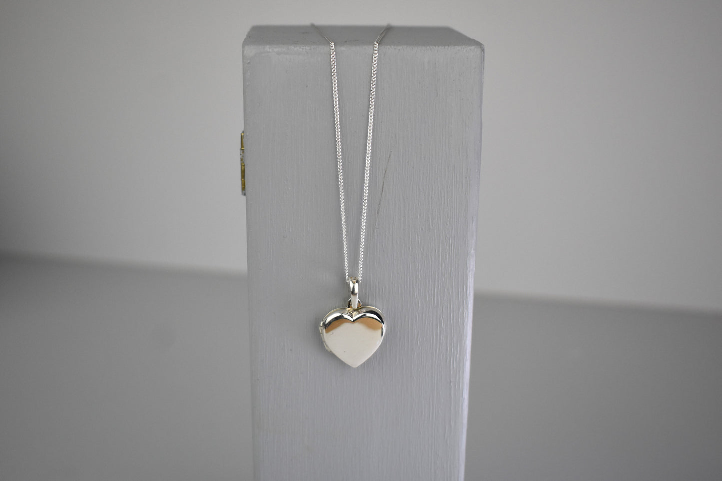 sterling silver heart locket removed from bouquet charm and placed on chain