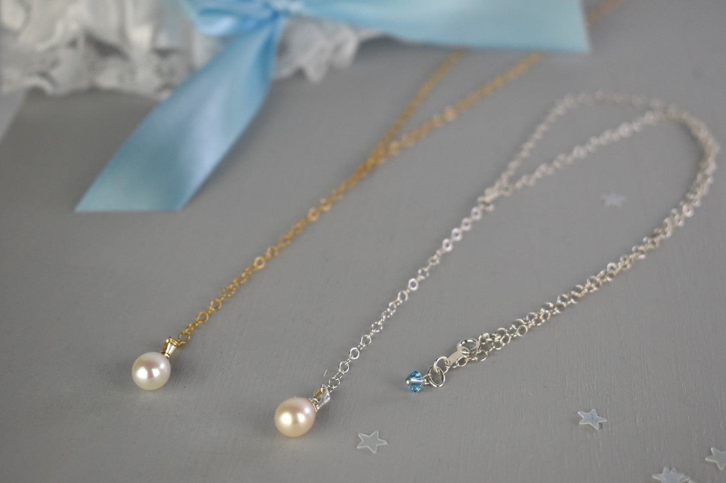 The lariat Something Blue set comes in your choice of finish, gold plated or sterling silver.