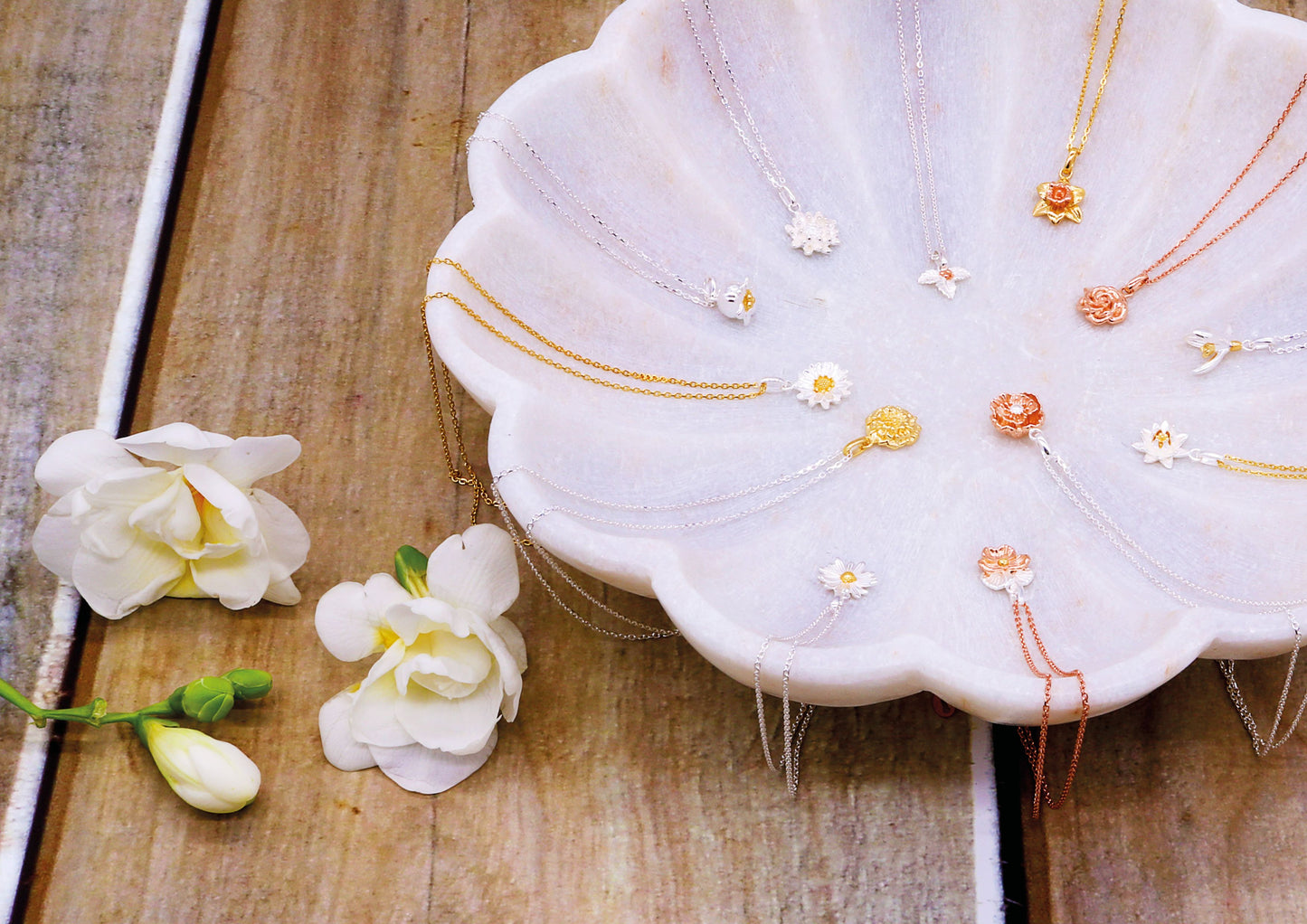 Birthday flower pendants in sterling silver, with gold and rose gold plating.