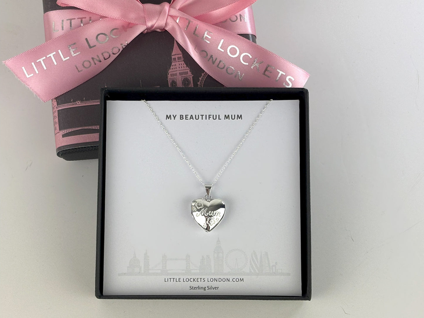 Heart shaped photo locket features delicate flowers engraved on the front, along with Mum. Crafted from high-quality sterling silver, it comes with a 16-18 inch extendable chain