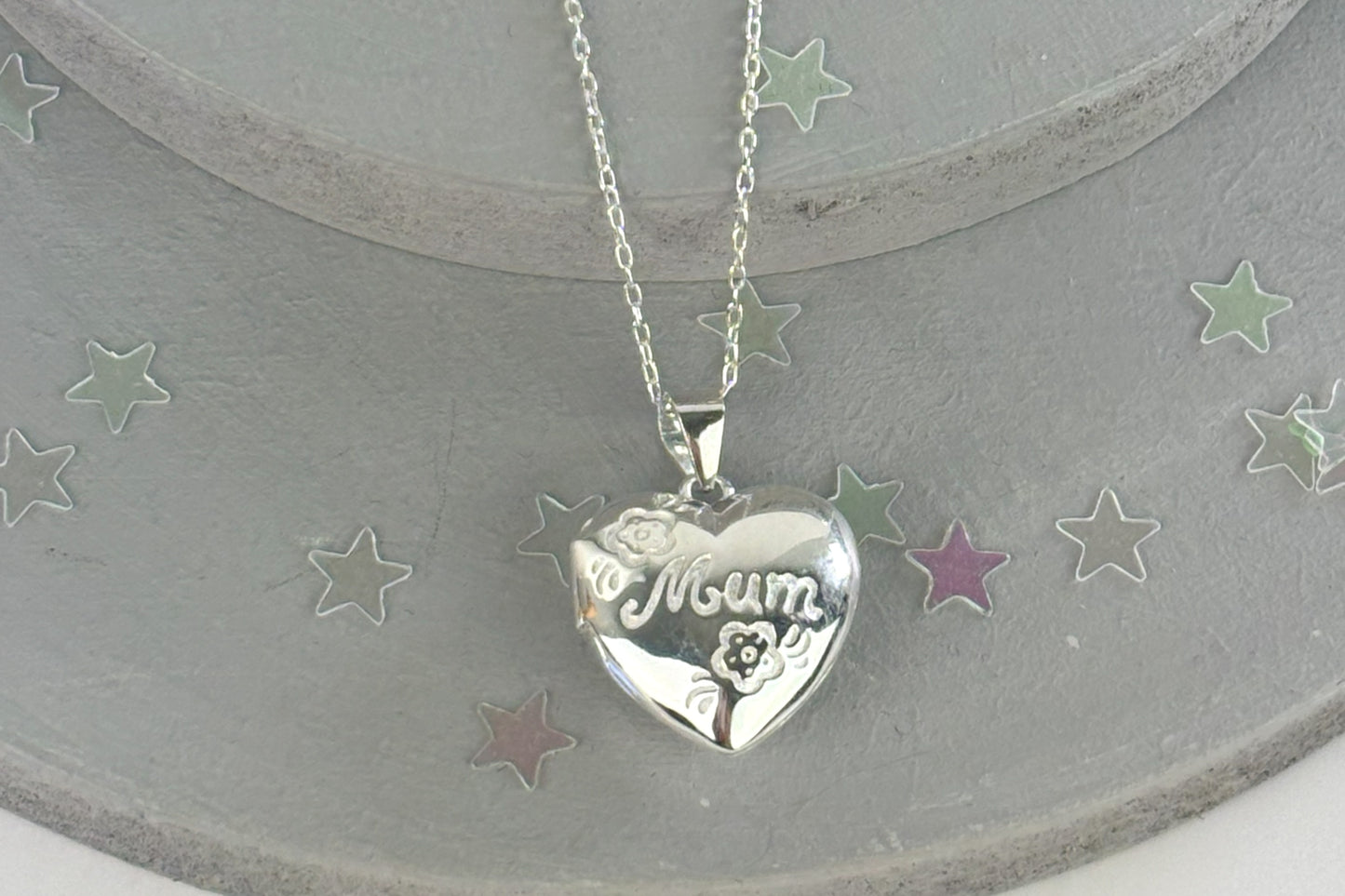 Sterling silver Mum locket with floral engraving on heart-shaped pendant