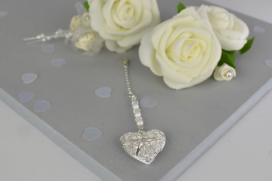 Our handmade wedding bouquet memorial charm with silver plated filigree locket shown complete with chain and lobster clasp.