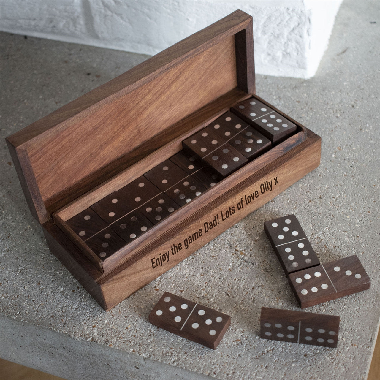 Sheesham wood domino box inlaid with aluminium and with your own personal message on the side of the box. Contains 28 mango wood, aluminium inlaid dominos