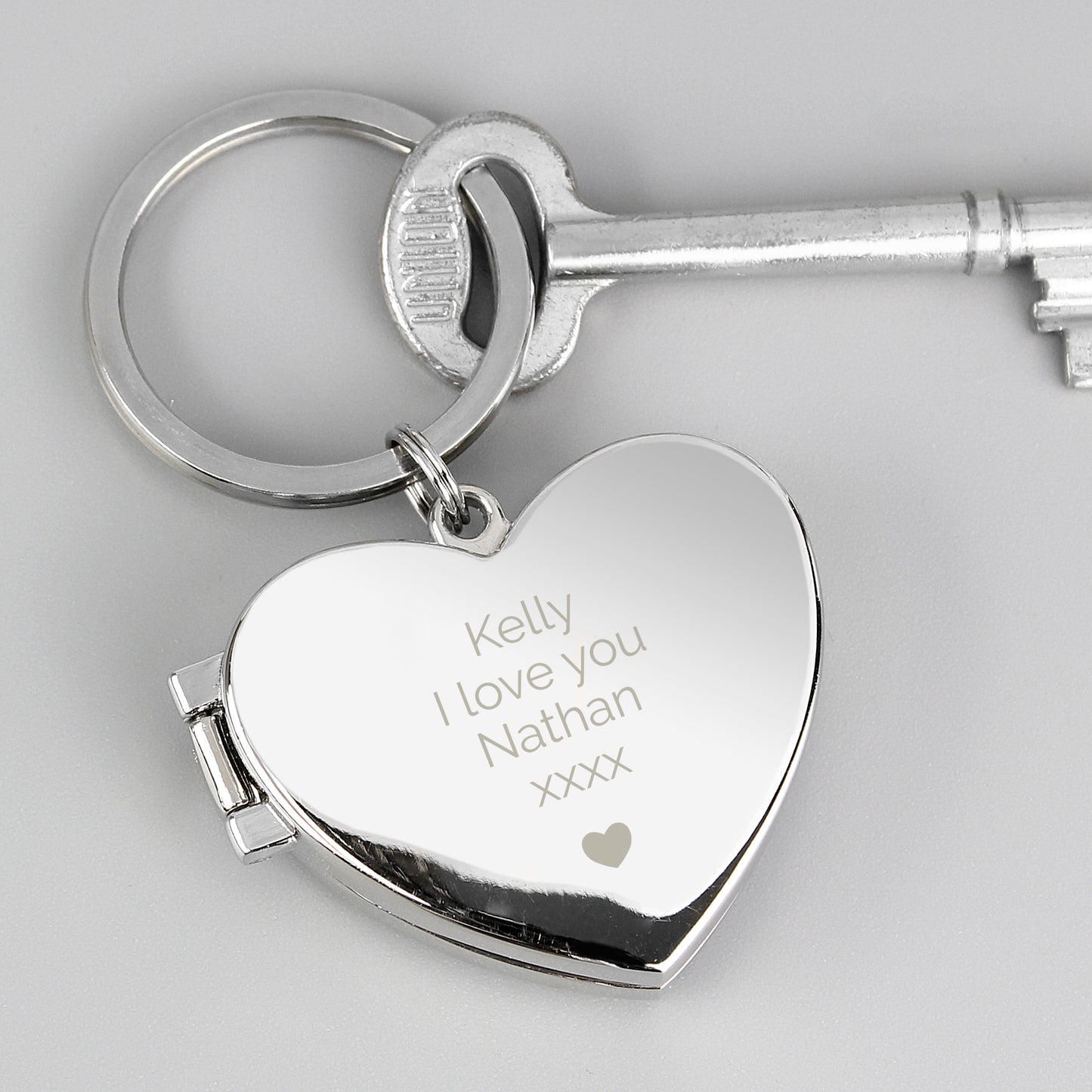Heart-shaped keychain with your own personalised message above the heart motif.
