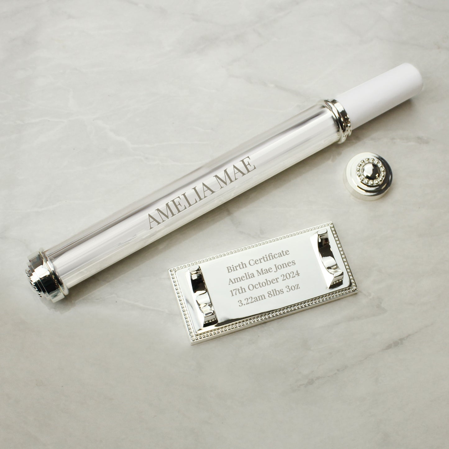 Silver plated certificate holder on a silver plated base shown as containing a birth cettificate for a baby and engraved with her name date of birth and birth weight