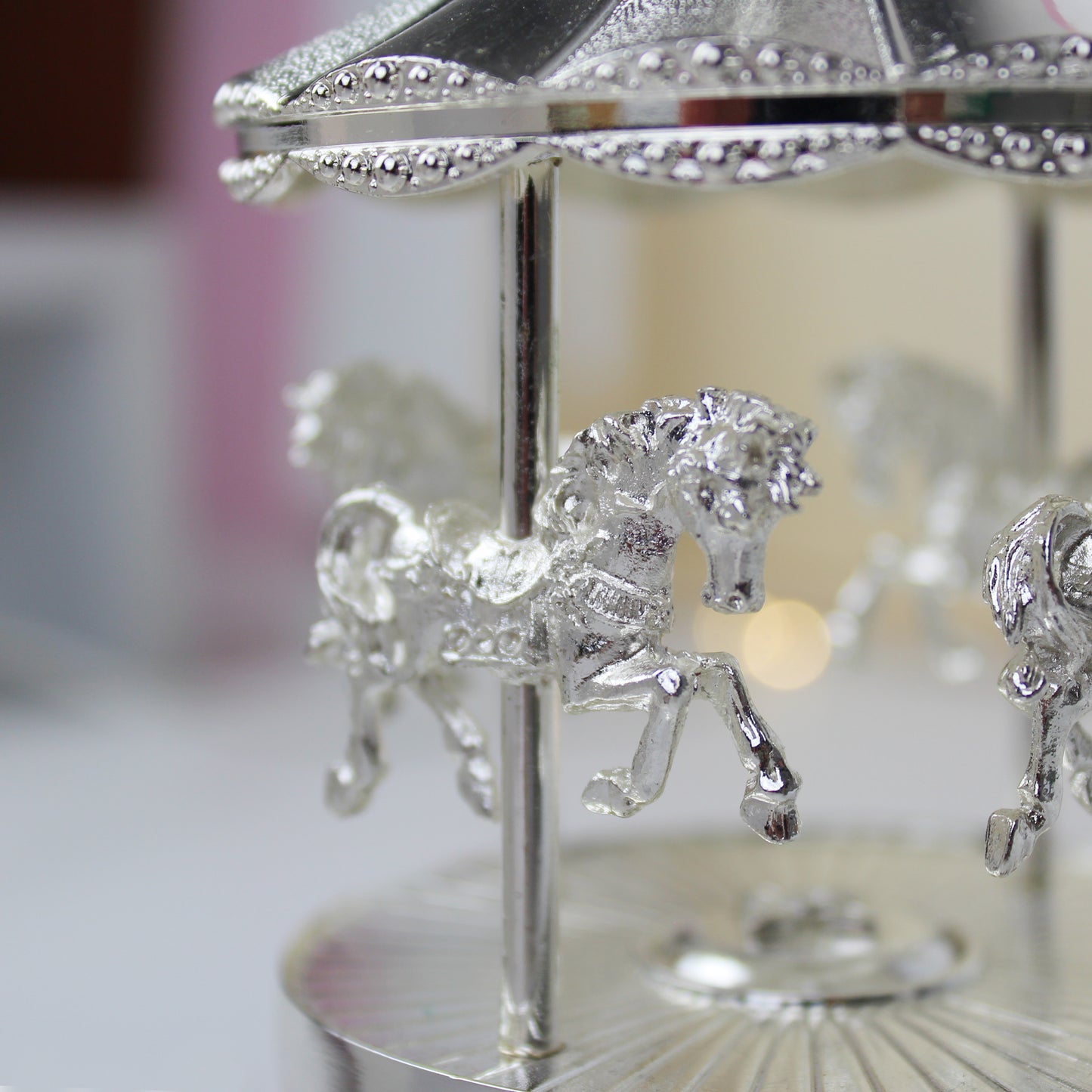 Pretty carousel music box, plays Rock-a-bye baby. Can be engraved with your own message.