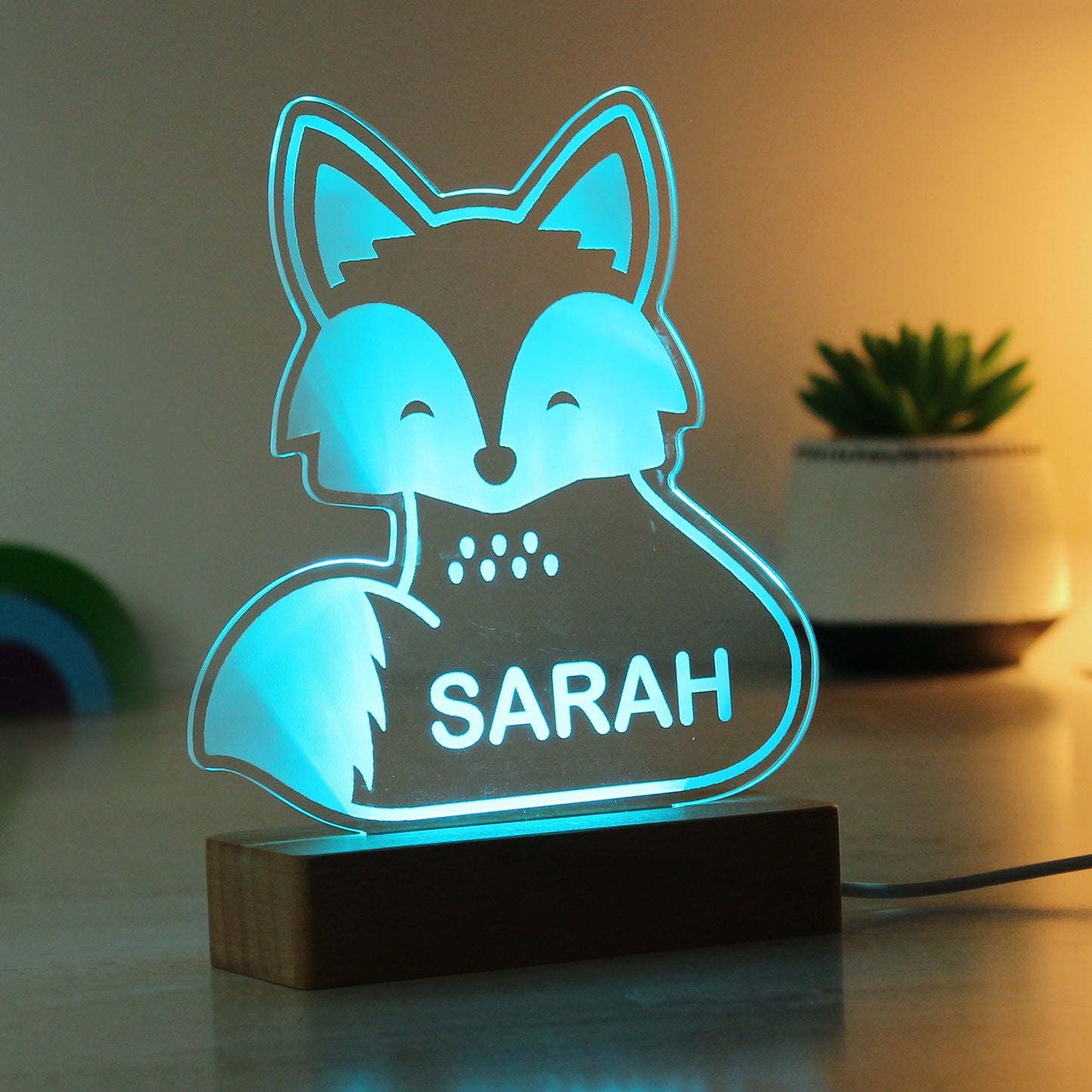 Childs LED light on wooden base. Fox personalised with your child's name. Changing or fixed colour and brightness settings. Shown in blue