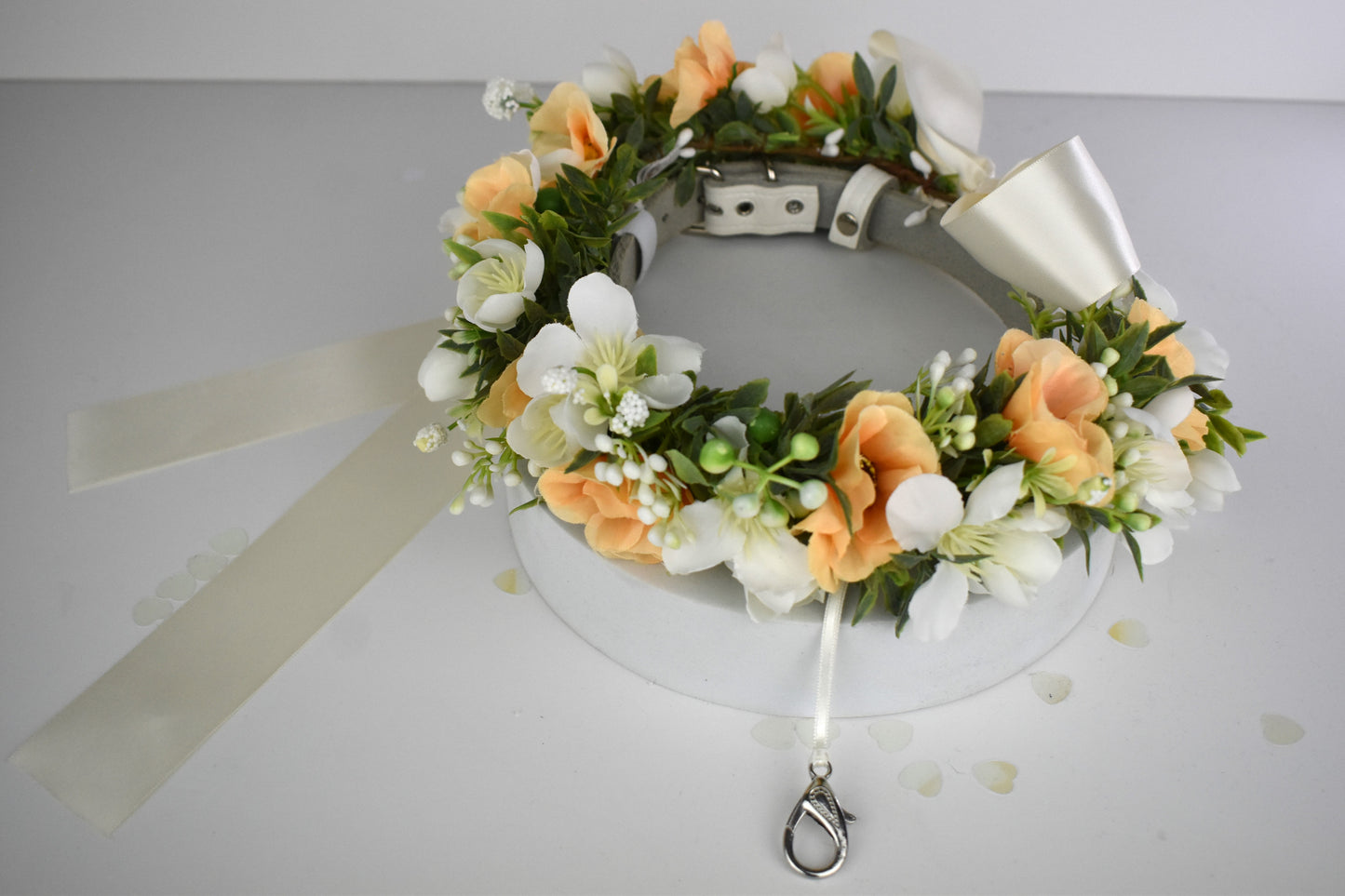 Full Flower Garland Dog Collar. Silk flower dog collar has a blend of buds and blossoms and a hint of woodland greenery, finished with ivory satin ribbon and attached to a white leather collar. Optional Ring Bearer Clasp