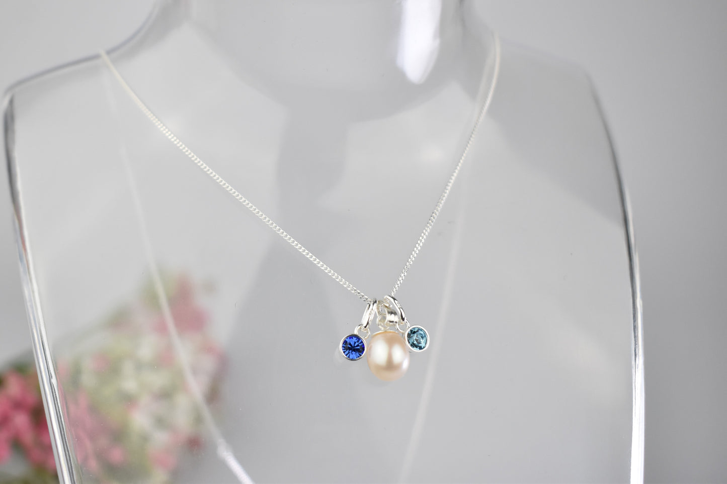 Freshwater pearl drop with two high quality birthstones suspended from an extendable 16-18" sterling silver chain