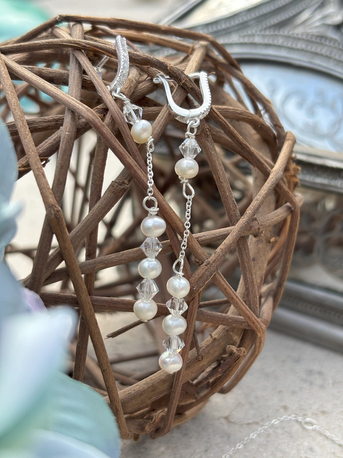 Pearl and crystal earrings using 4mm freshwater pearls and highest quality crystals (also 4mm). The earrings are suspended from sterling silver hoops studded with tiny crystals to reflect the light.