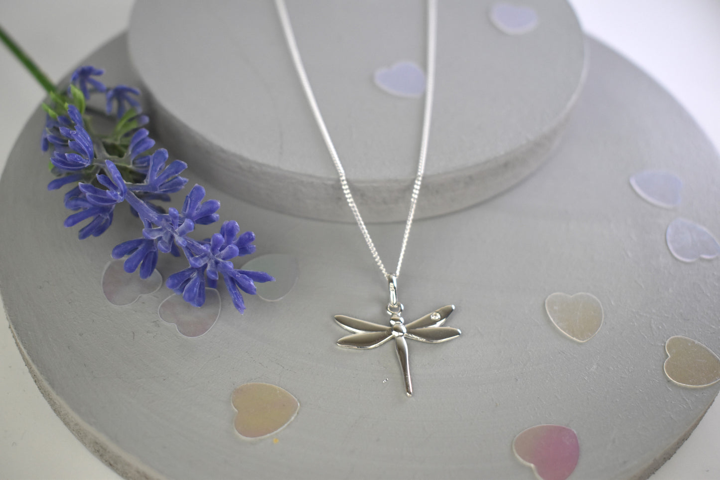 Dragonfly is sterling silver with a sparkling cubic zirconia crystal on its wing.