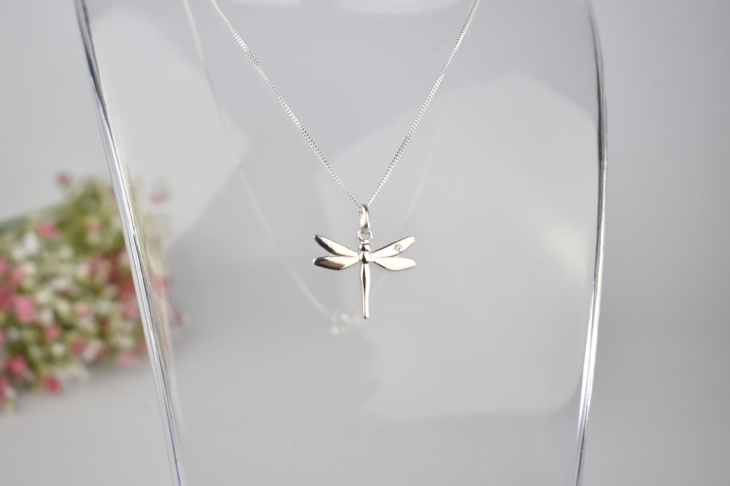Dragonfly is sterling silver with a sparkling cubic zirconia crystal on its wing.