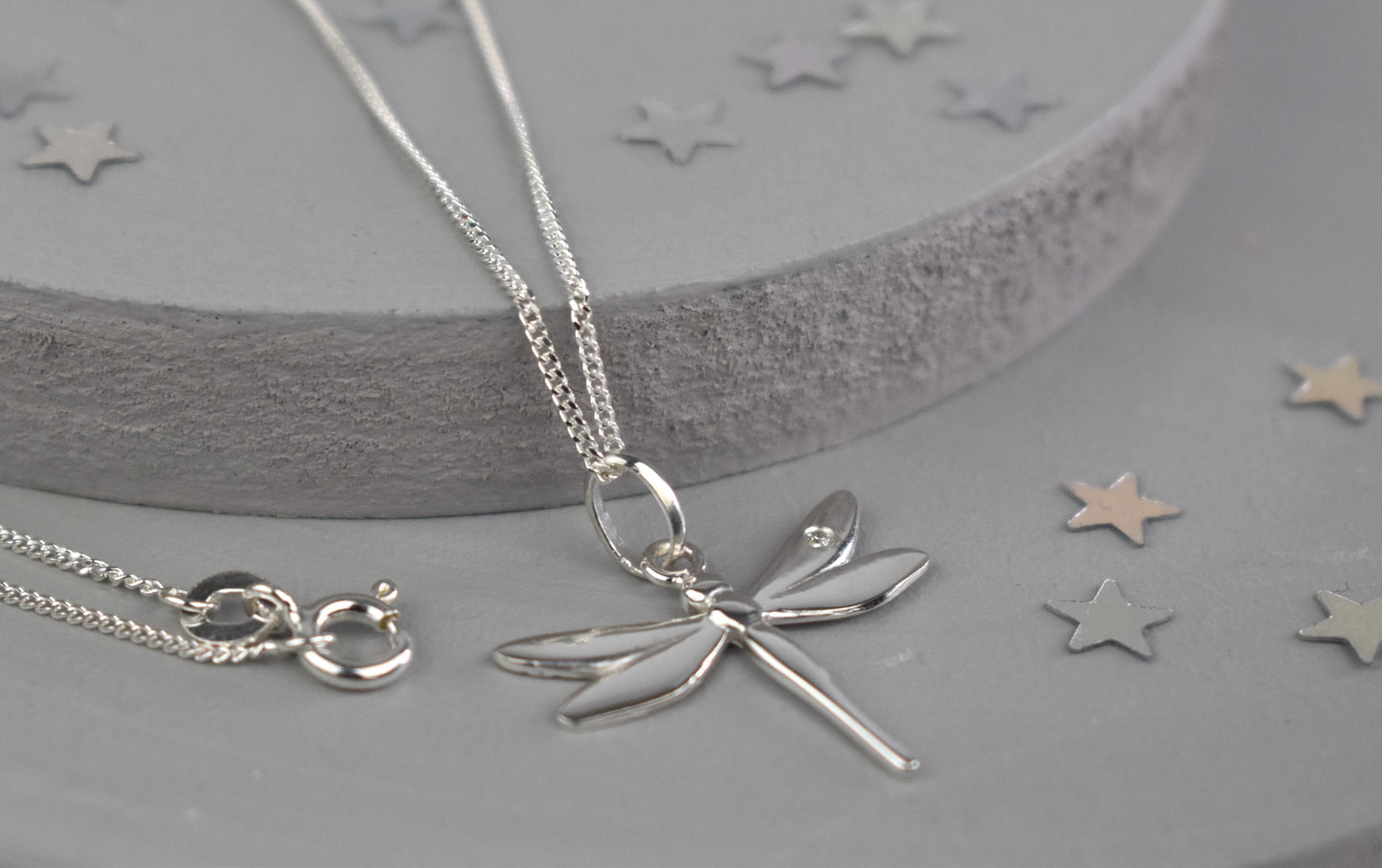 Dragonfly is sterling silver with a sparkling cubic zirconia crystal on its wing.