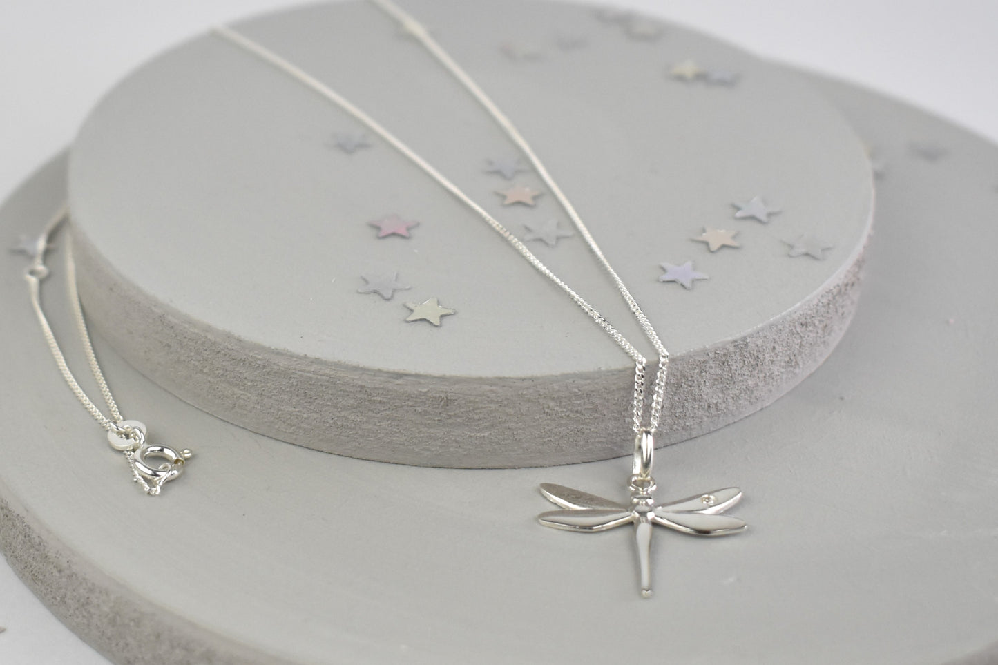 Dragonfly is sterling silver with a sparkling cubic zirconia crystal on its wing.