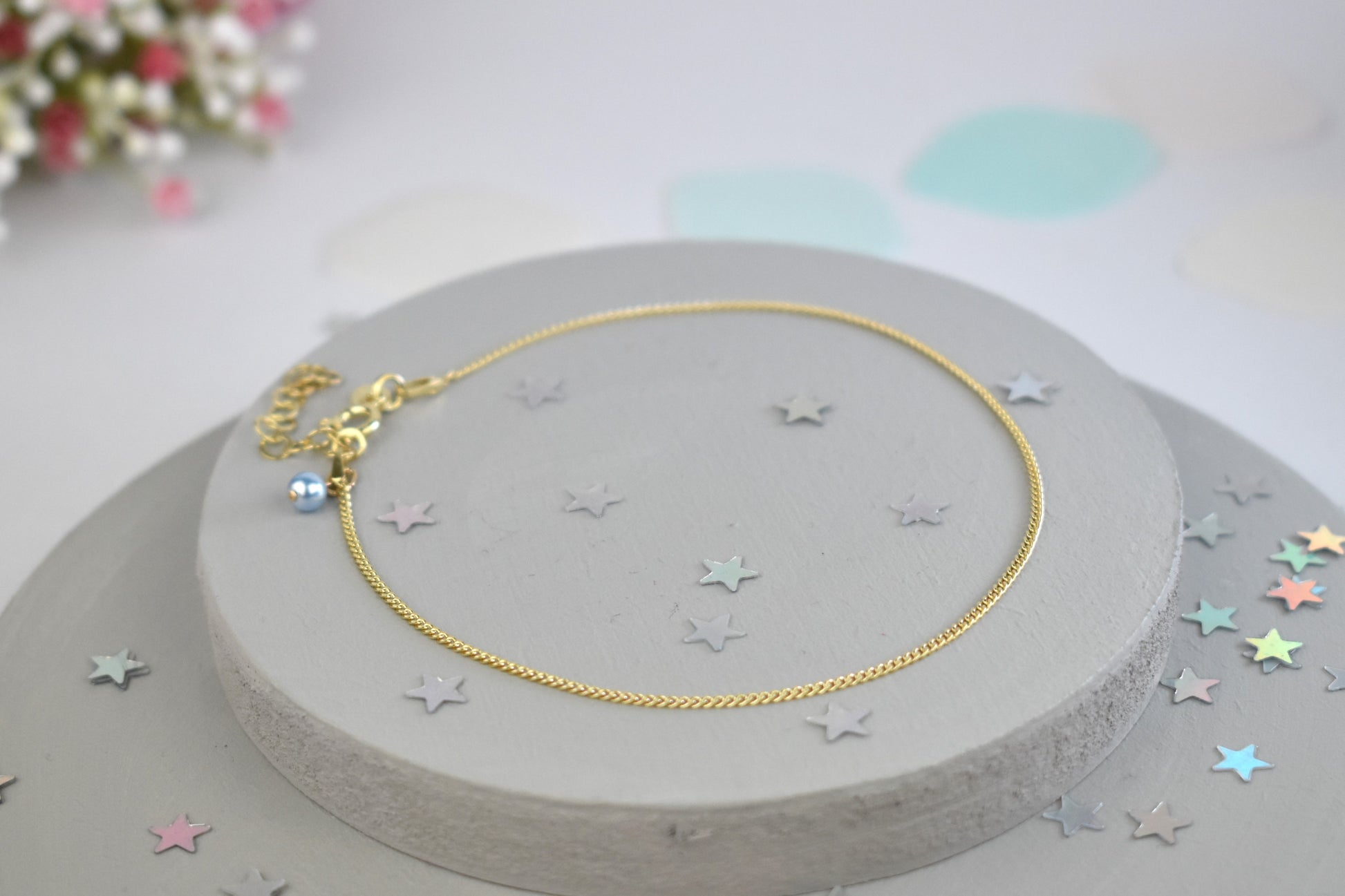 Gold-plated sterling silver anklet with delicate blue crystal
