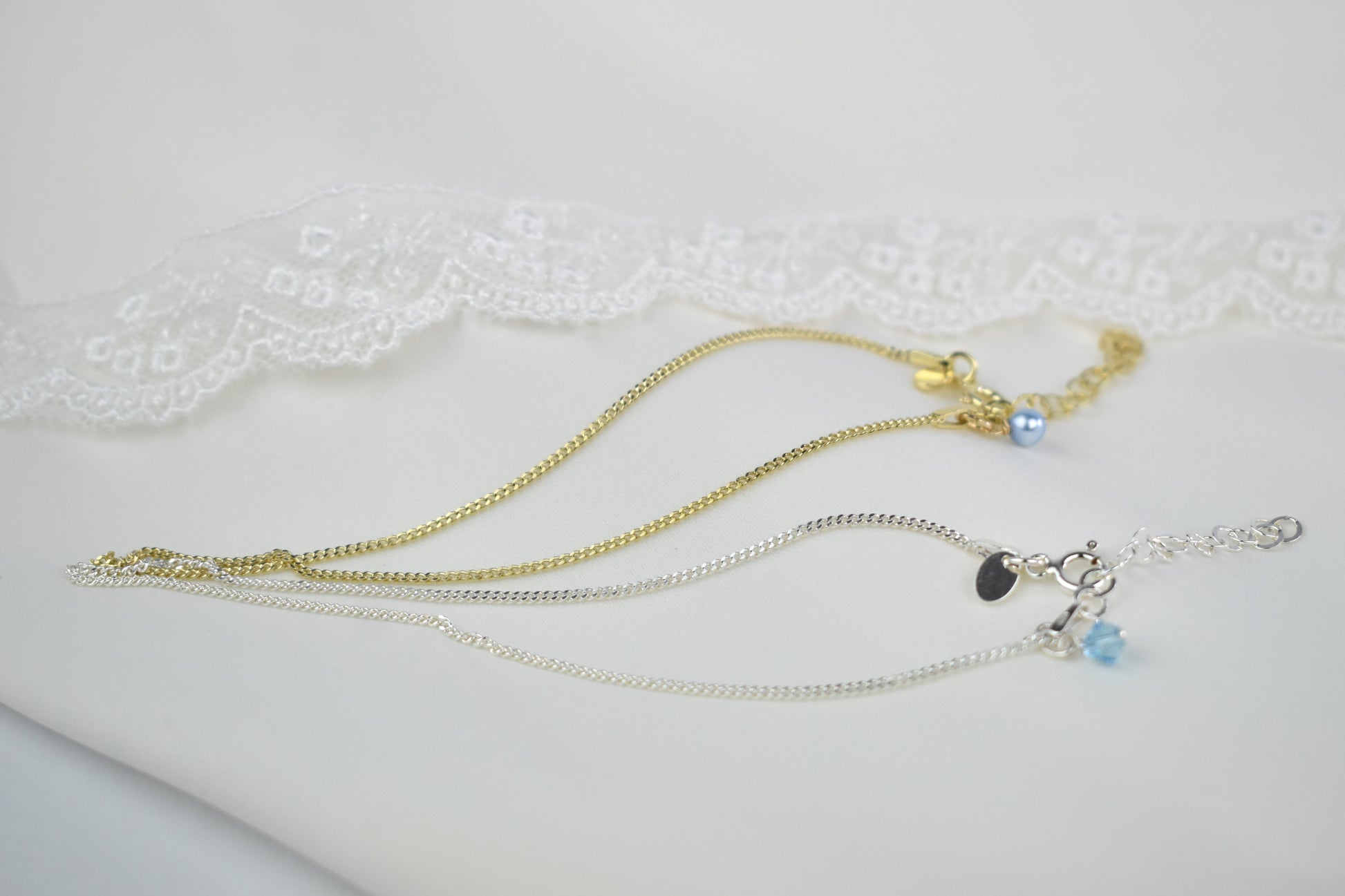 Something Blue anklet available in your choice of sterling silver or sterling silver with gold plating. Choice of blue pearl or blue crystal to finish your anklet.