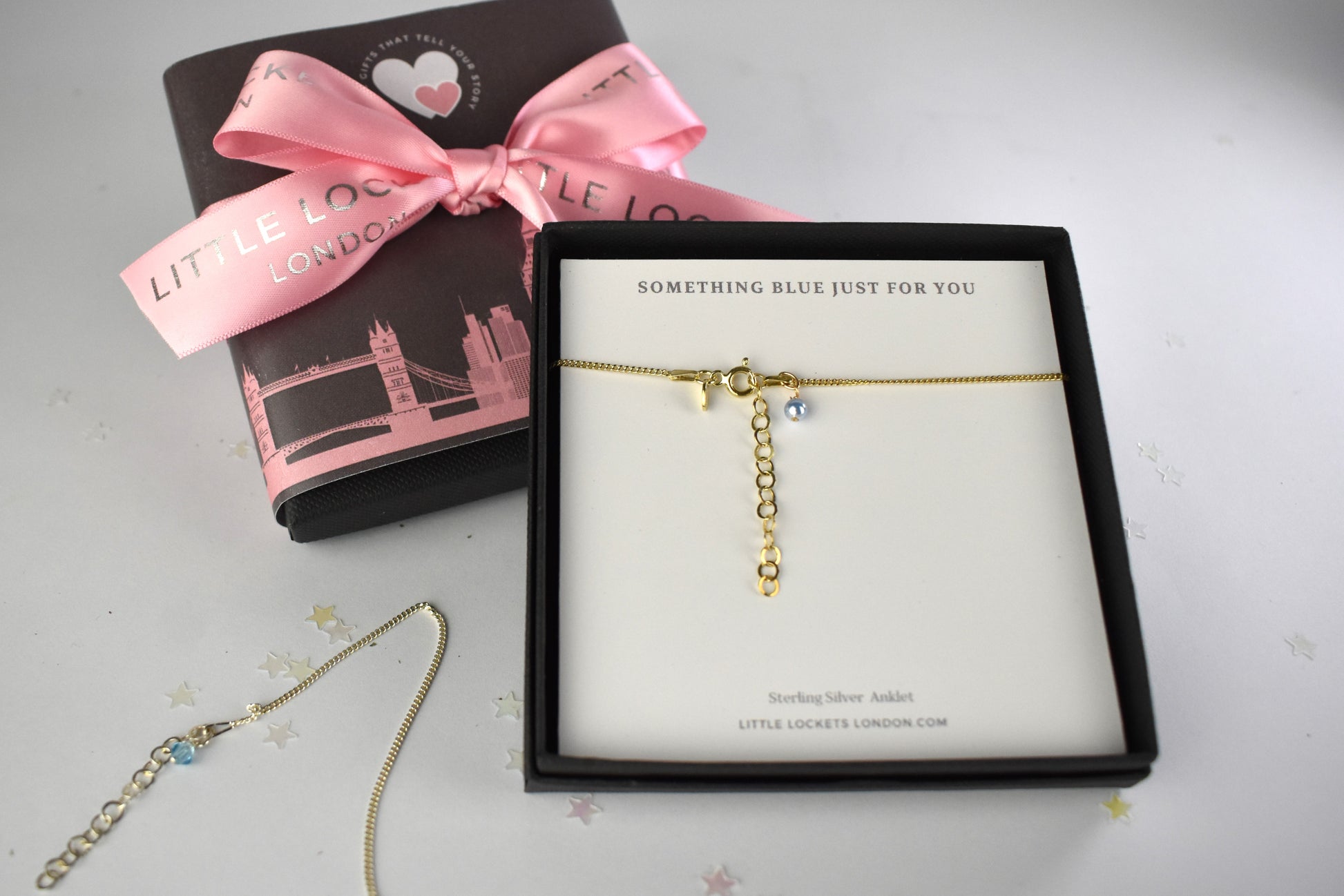 Gold plated version shown gift box and with optional skyline wrap and ribbon in the background.
