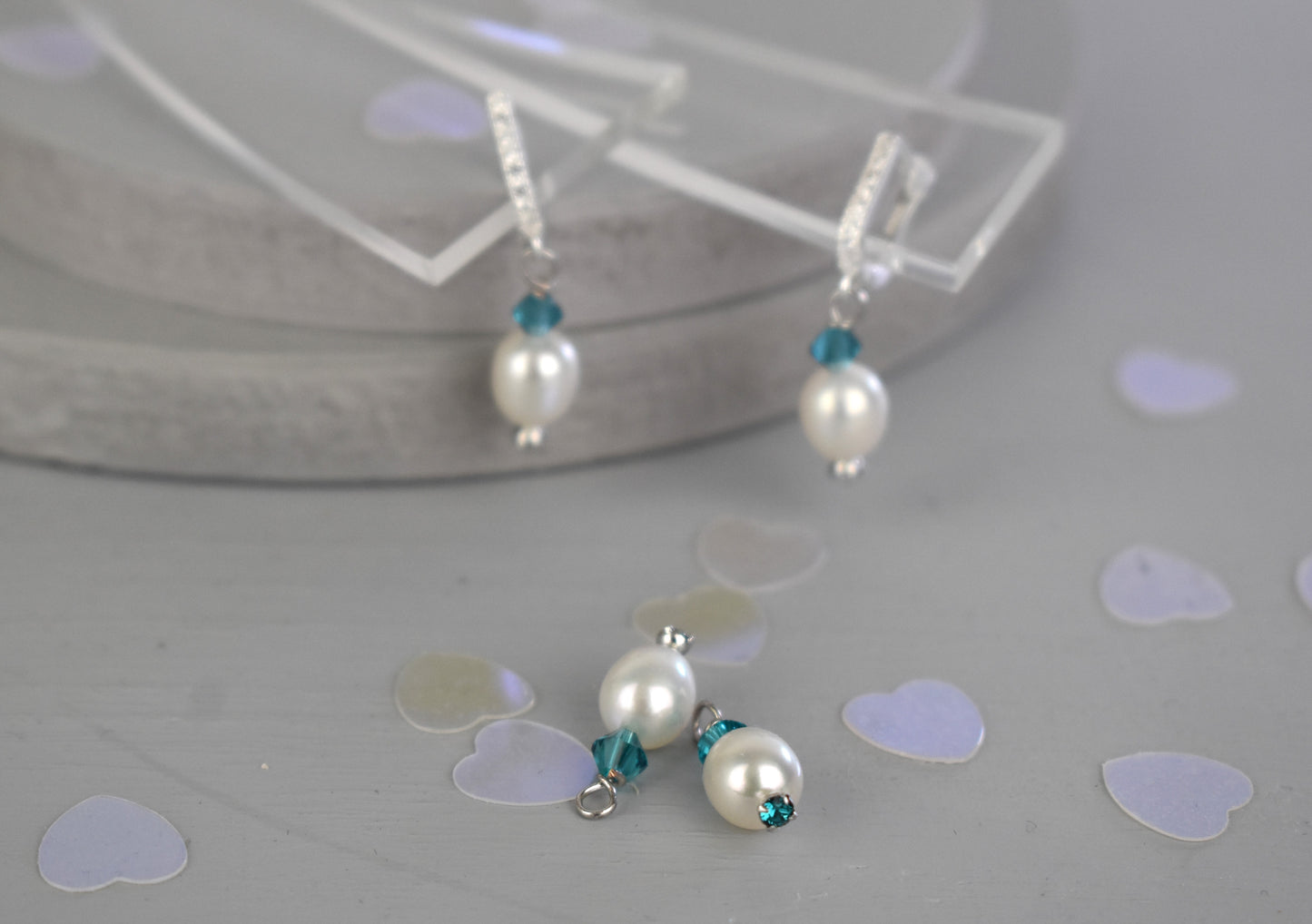 freshwater pearl earrings with blue zircon Austrian crystals hung from your choice of sterling silver or gold platedear wires trimmed with diamante