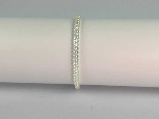 Simple glass 4mm beads form this elasticated stacking bracelet