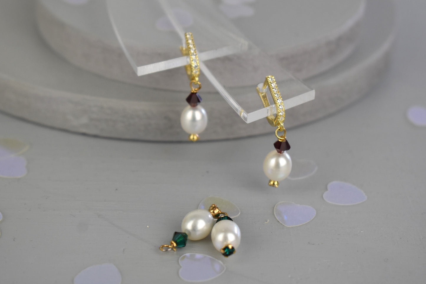 freshwater pearl earrings with emerald green Austrian crystals hung from your choice of sterling silver or gold platedear wires trimmed with diamante