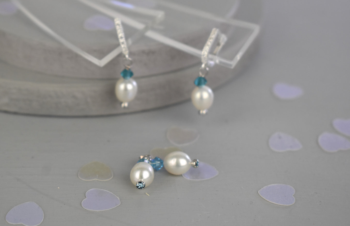 freshwater pearl earrings with light sapphire Austrian crystals hung from your choice of sterling silver or gold plated ear wires trimmed with diamante