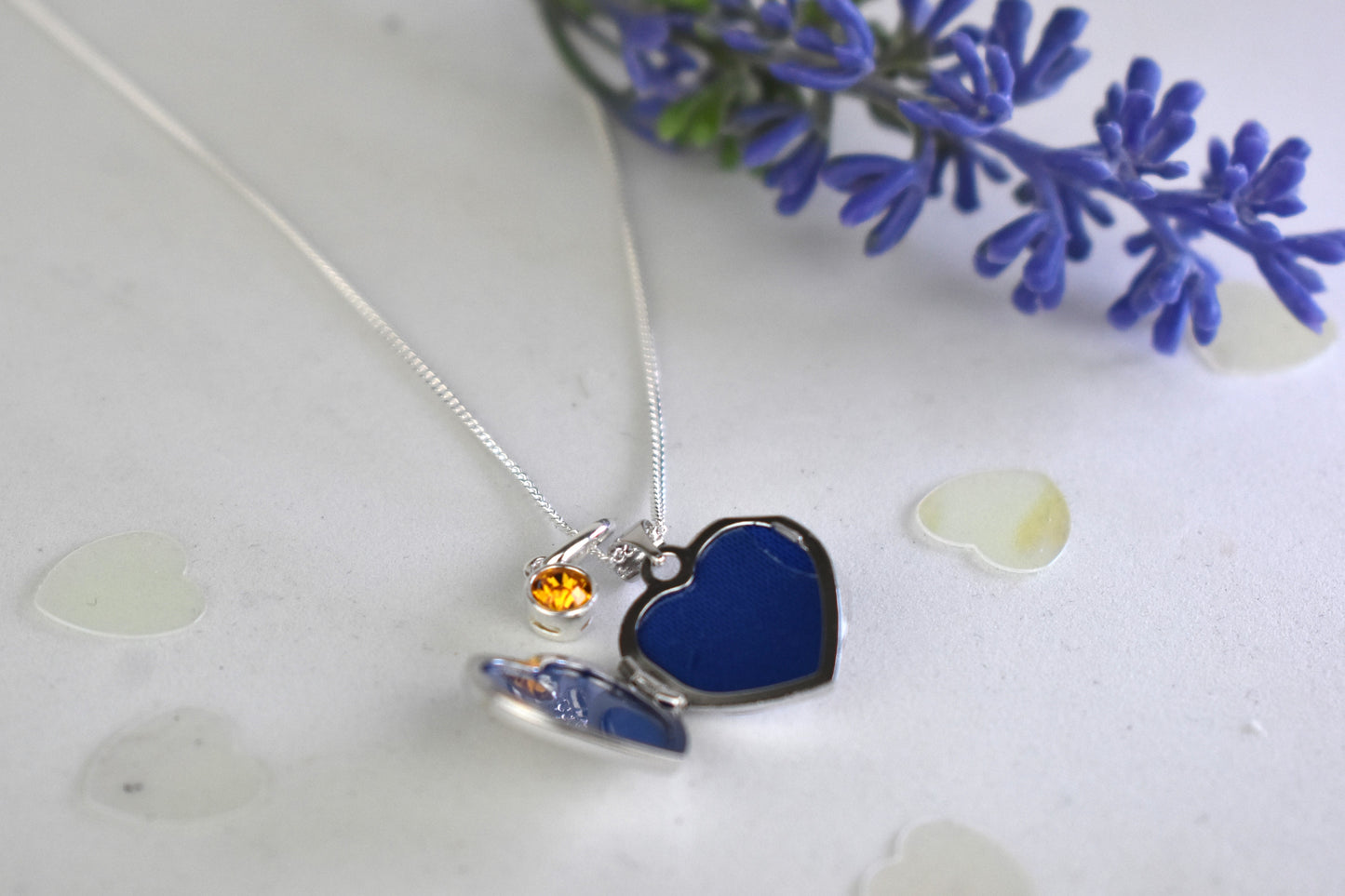 sterling silver heart locket on 14" sterling silver chain. Shown open to take two photos and with optional birthstone.