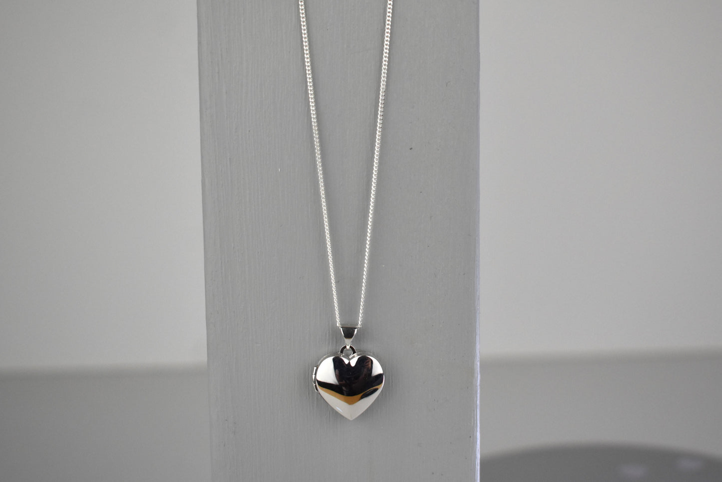 sterling silver heart locket on 14" sterling silver chain.