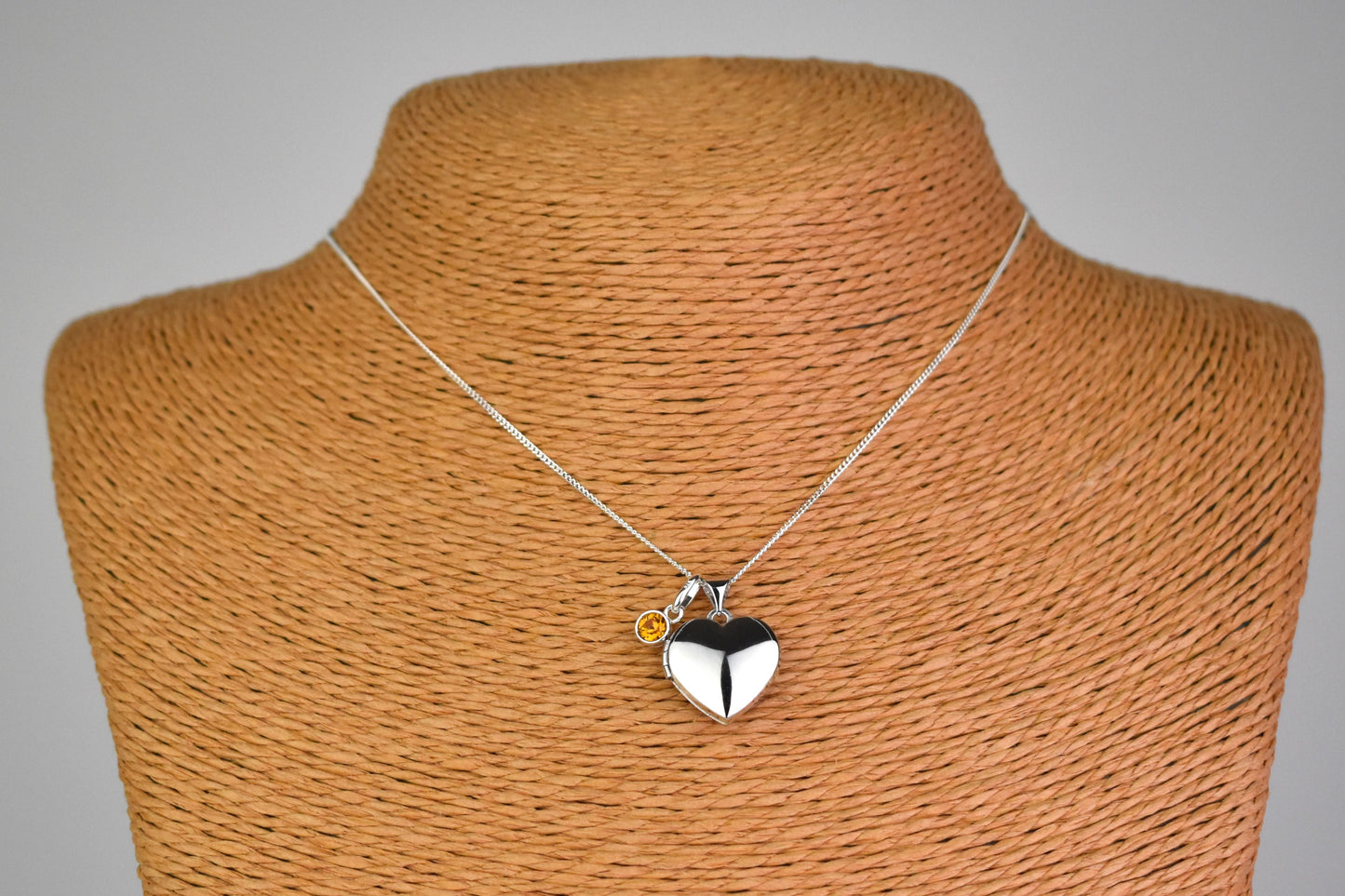 sterling silver heart locket on 14" sterling silver chain. Shown with optional birthstone