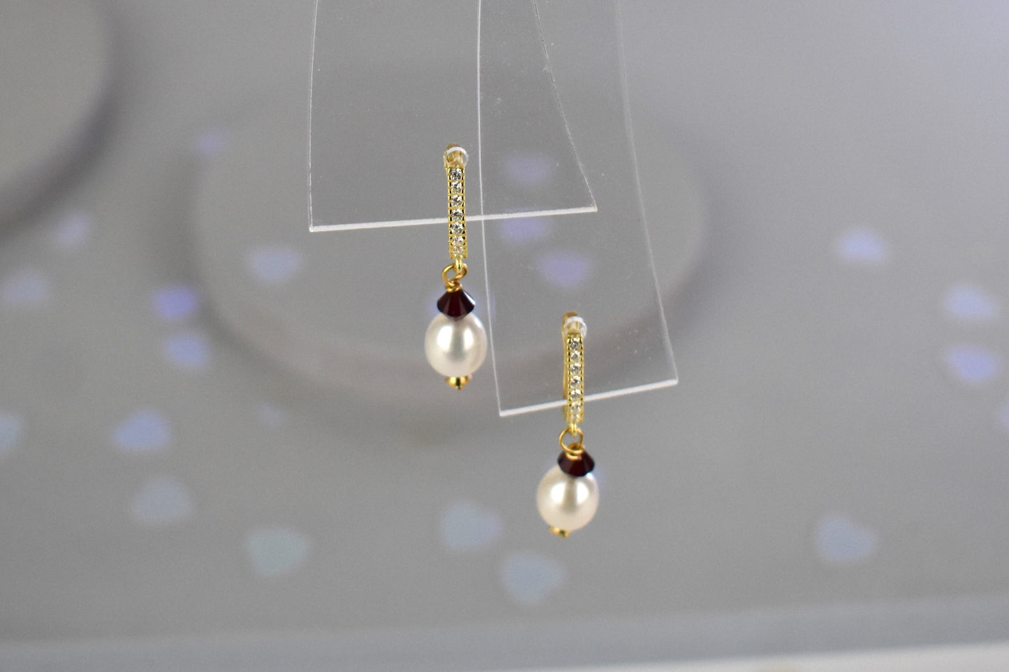 freshwater pearl earrings with siamAustrian crystals hung from your choice of sterling silver or gold plated ear wires trimmed with diamante