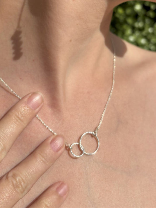 Sterling silver sparkly entwined circles on an adjustable sterling silver chain