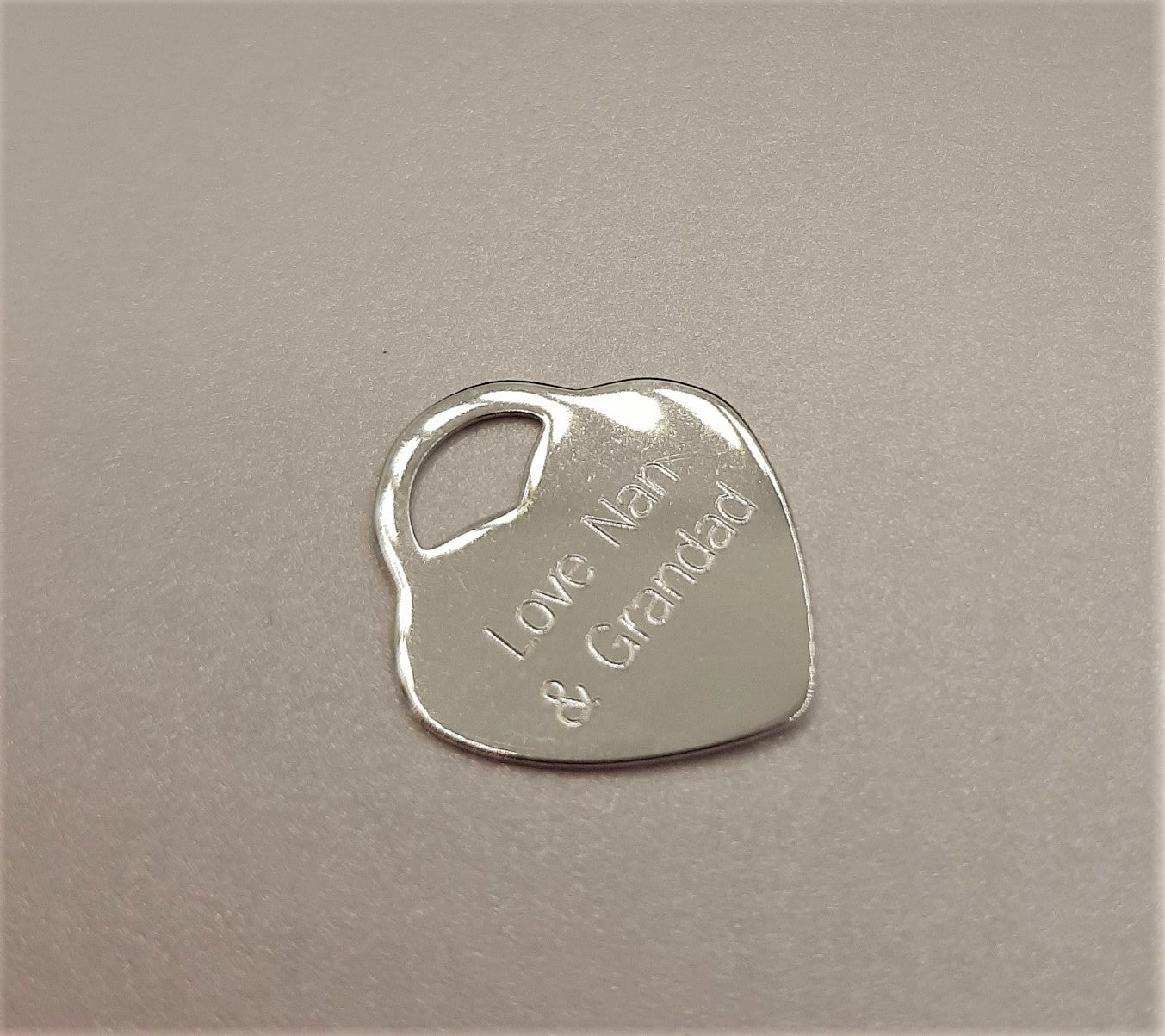 Optional sterling silver heart with message of your choice that can be added to the wedding party memorial locket. Up to 10 characters per line, two lines per side.