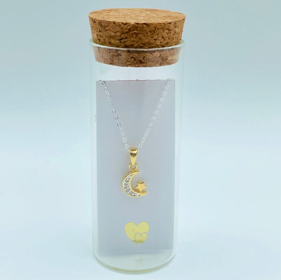 gold vermeil crescent moon with cubic zircona and tiny star on a sterling silver chain in a glass bottle with cork top. Little Lockets London Message In a Bottle range