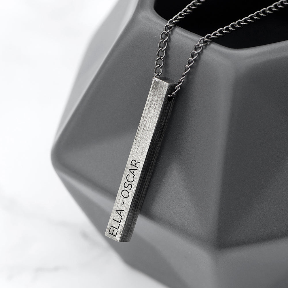 Gunmetal grey bar on gunmetal chain. Bar is engraved with the name of your choice.